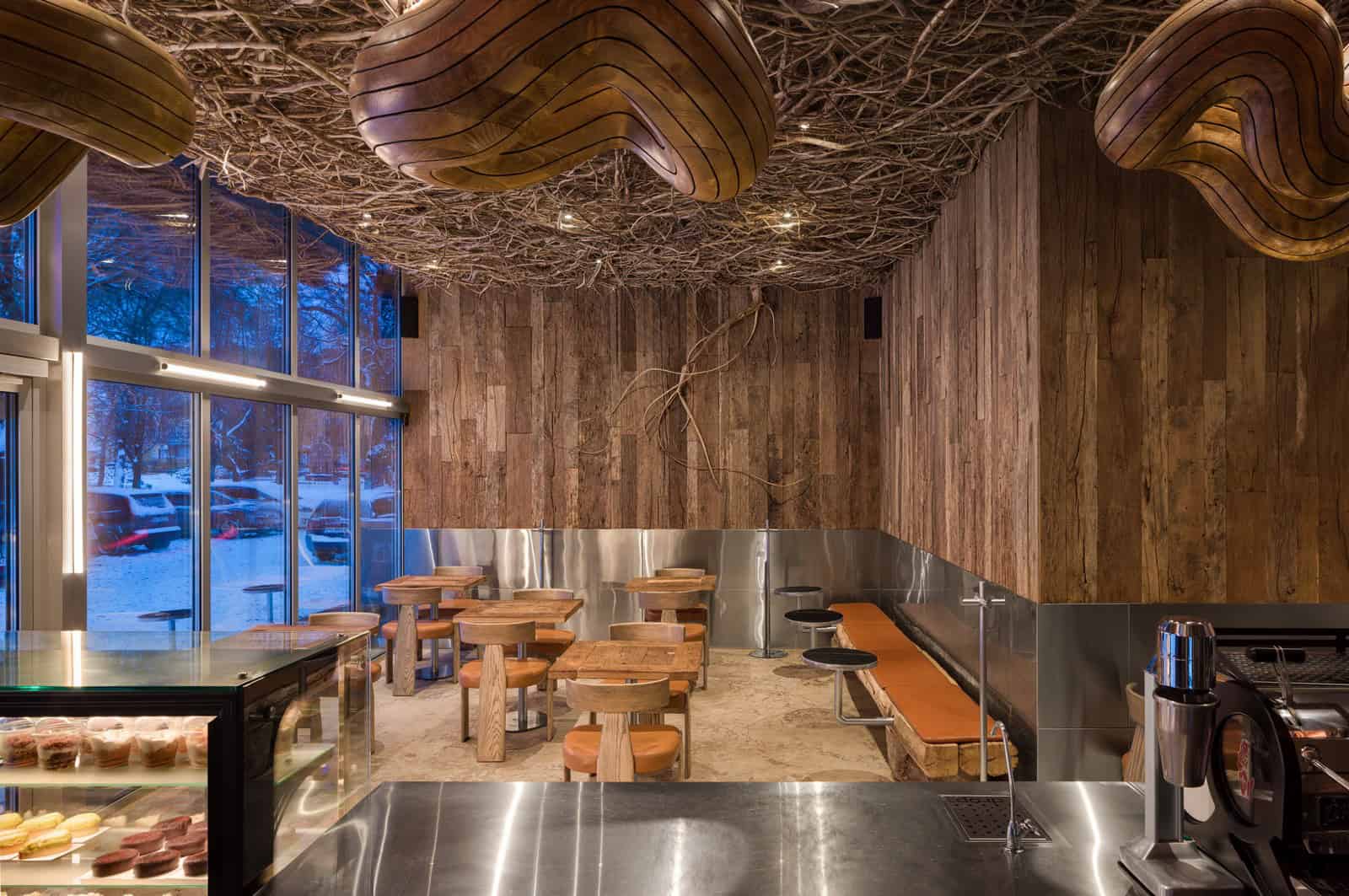 Coffee Shop Kovel Glow Lighting Organic Ceiling Glowing lights enhance the organic twig ceiling in a cozy evening coffee shop interior