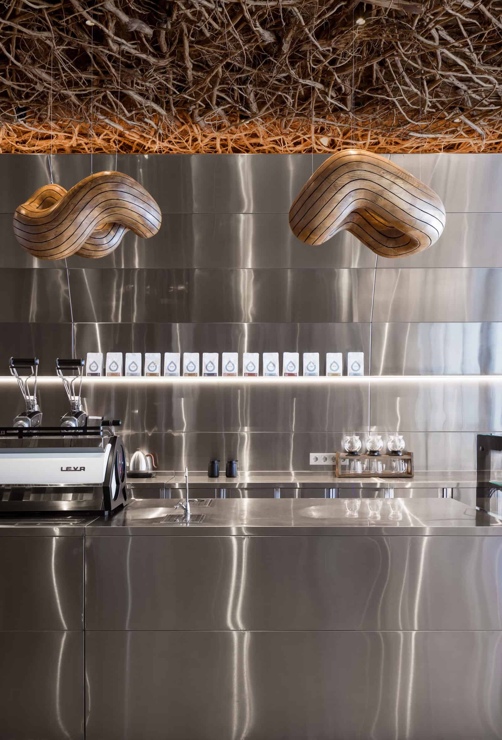 Coffee Shop Kovel Lighting Above Coffee Bar Wooden pendant lights hanging above coffee bar in stylish interior