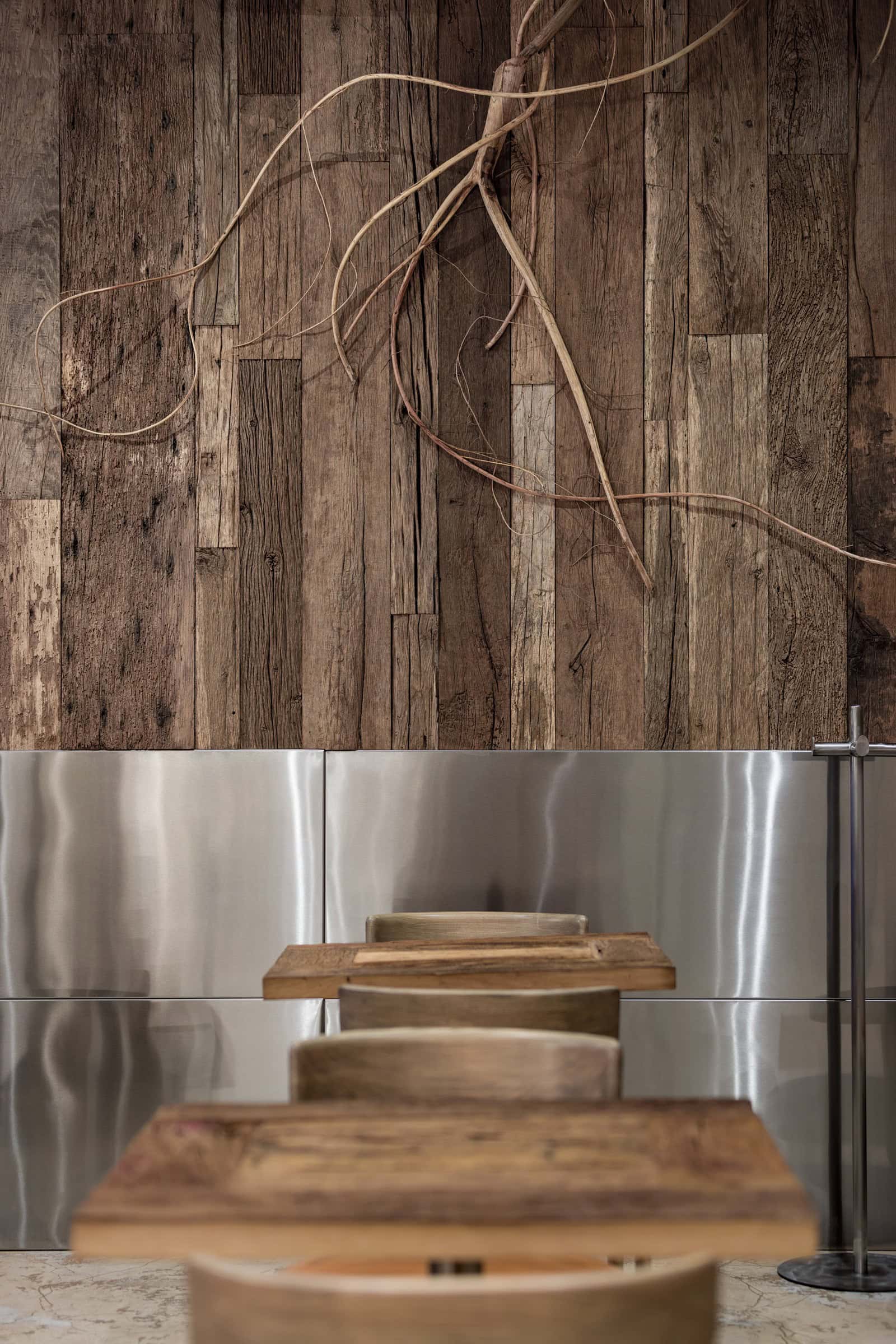 Coffee Shop Kovel Wall Sculpture Wood Wooden wall sculpture detail inside coffee shop with stainless steel cladding