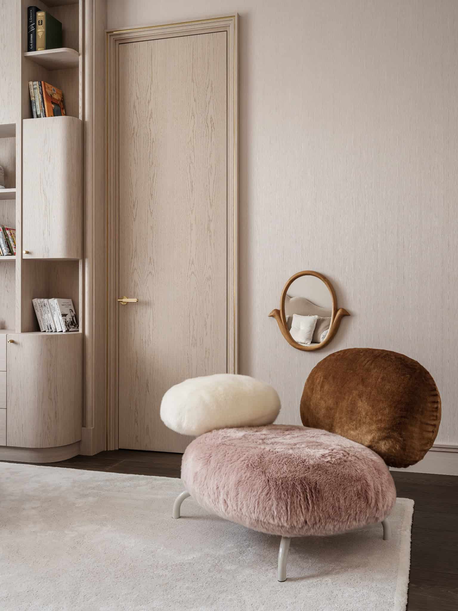Colorful Shearling Chair in Book Nook Playful reading corner with multi-toned shearling chair and soft beige walls.