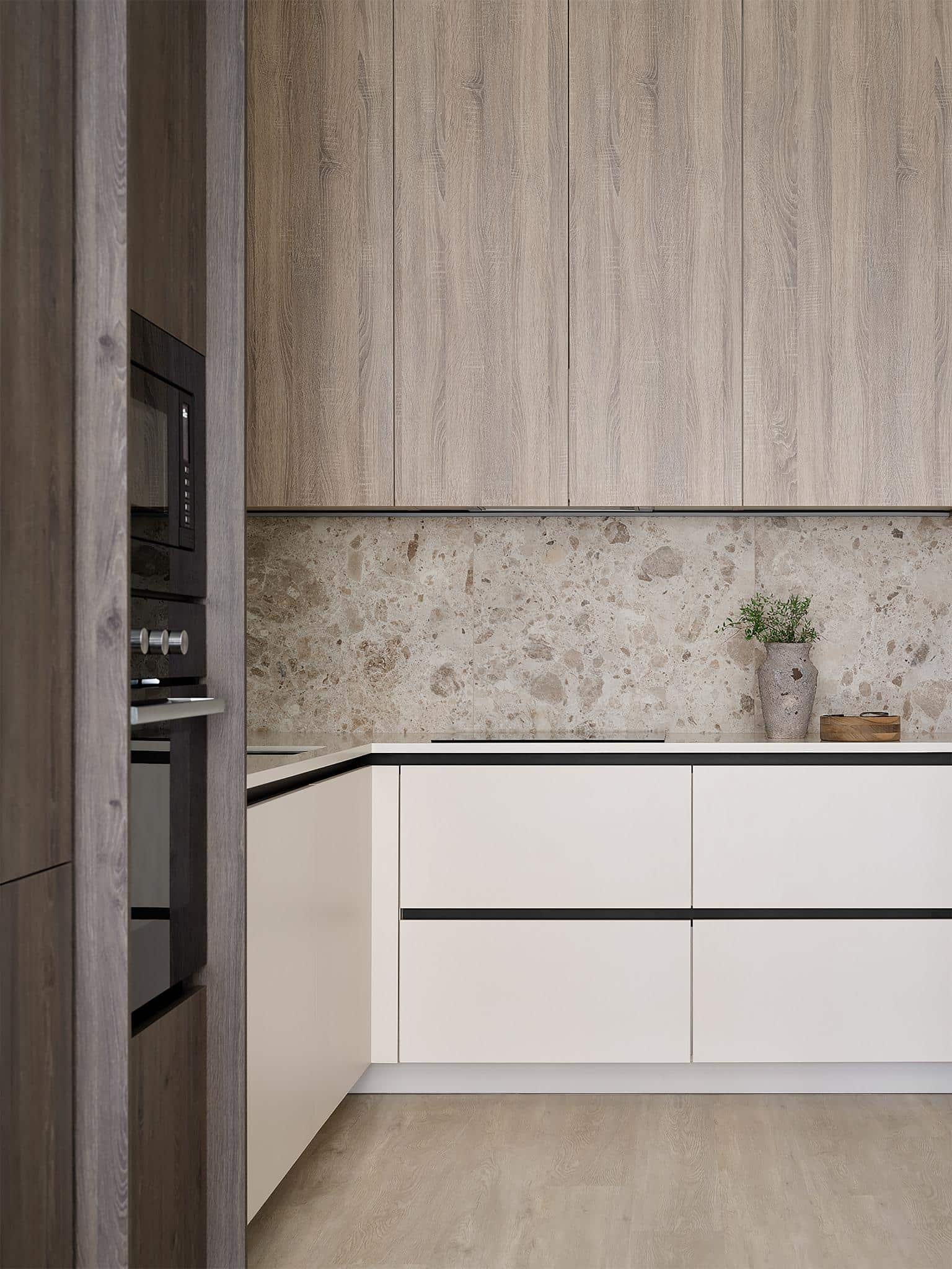 Contemporary Kitchen with Built-In Appliances Contemporary kitchen featuring built-in oven and microwave within wood cabinetry.