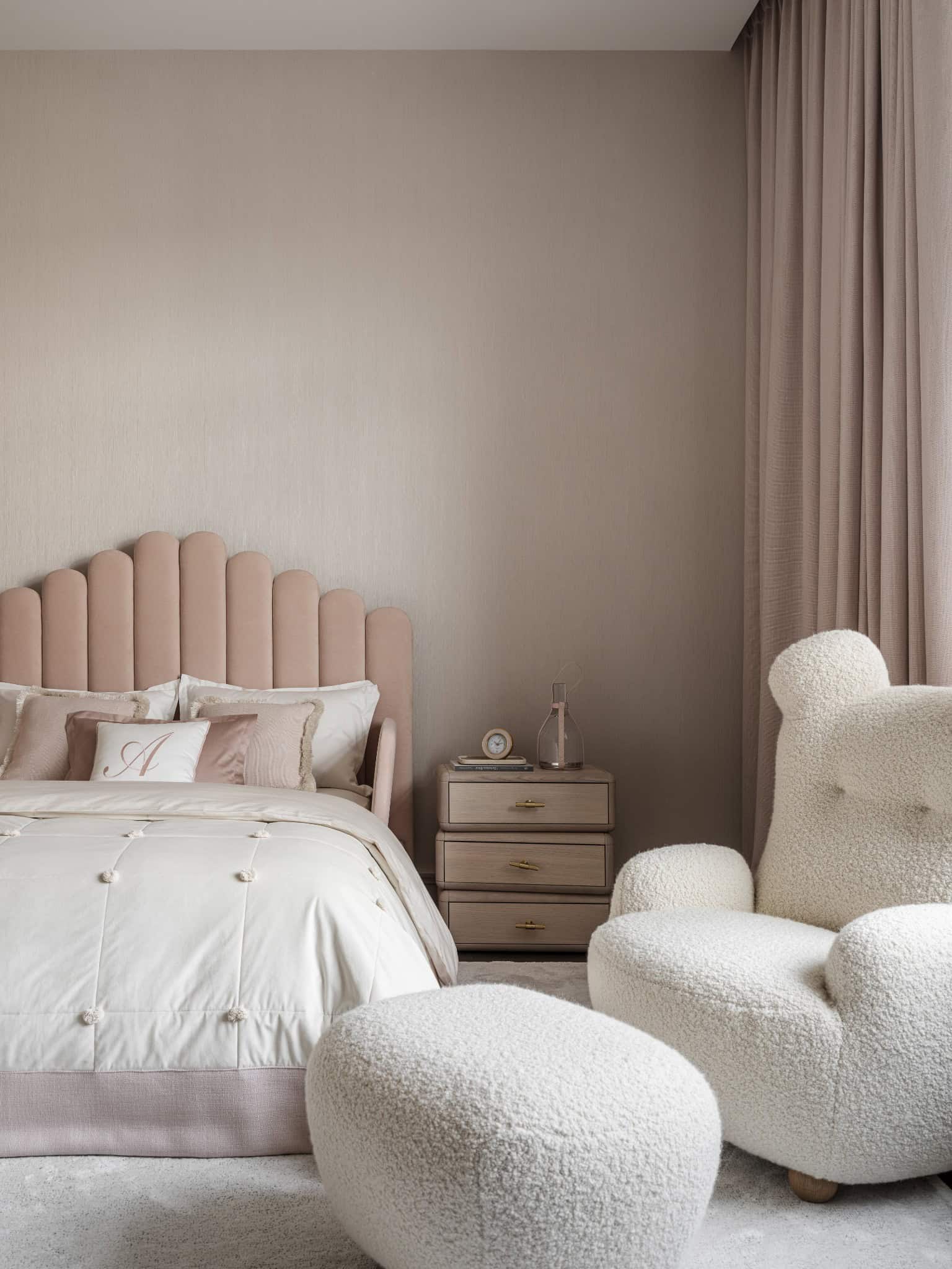 Cozy Kids Bedroom with Teddy Chair Soft kids bedroom with teddy bear-style chair and minimalist wall decor.