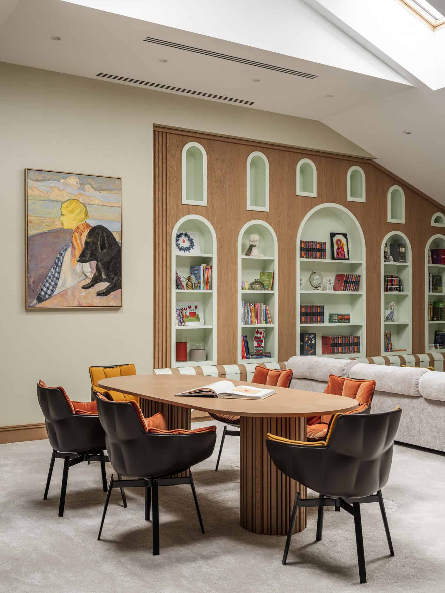 Creative Family Library with Arched Shelves Colorful family library with arched niches and reading table.