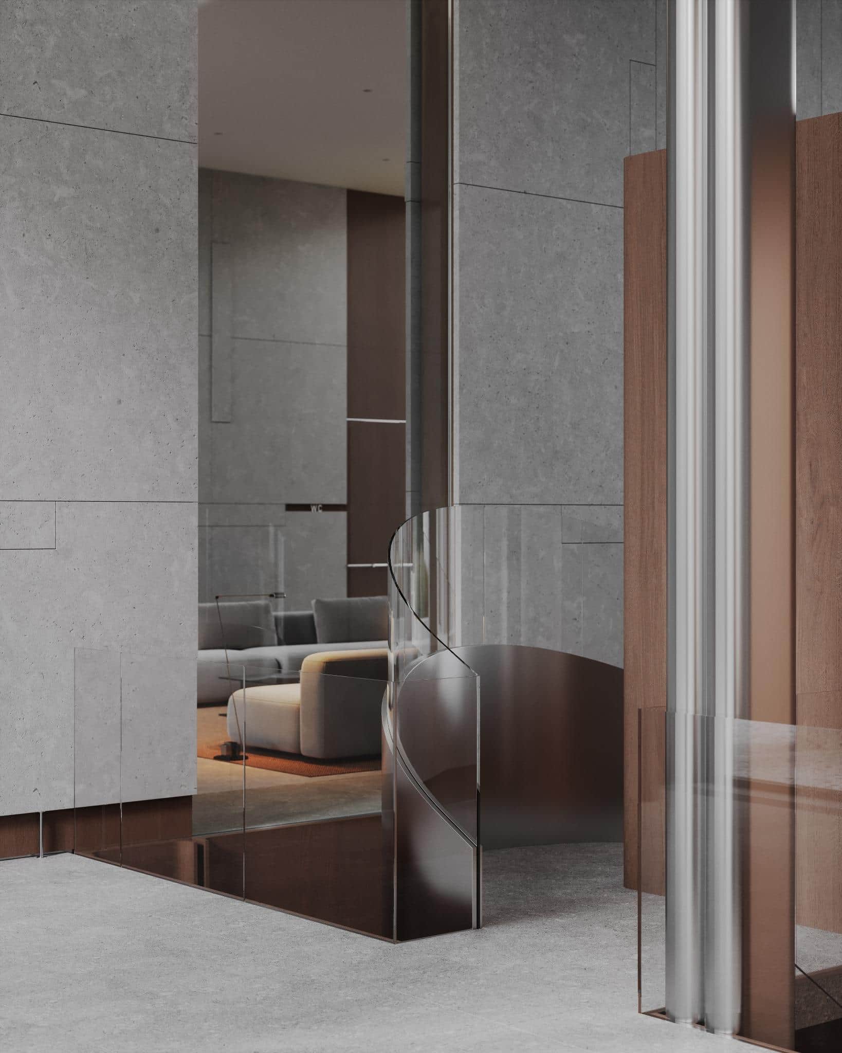 Curved Glass Railing with Sofa in Background Elegant glass railing spiraling next to soft gray seating in a modern lobby.