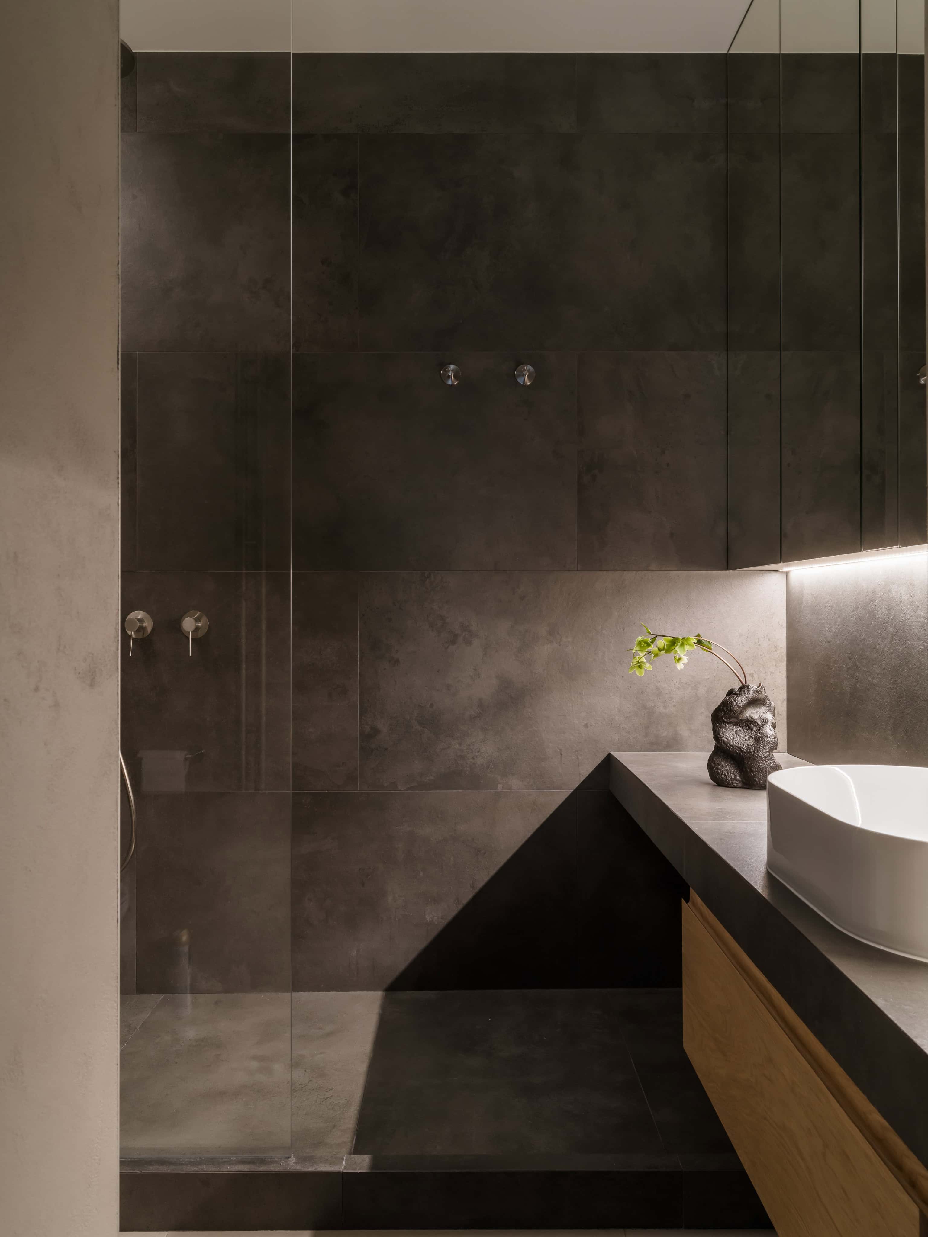 Dark Tile Modern Bathroom Shower Contemporary shower space with dark matte tiles and minimal fixtures.