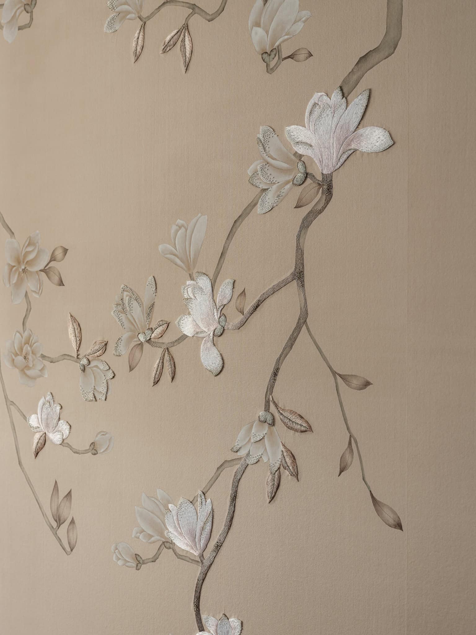 Delicate Botanical Wallpaper Closeup Close-up of embossed floral wallpaper with intricate petal textures.