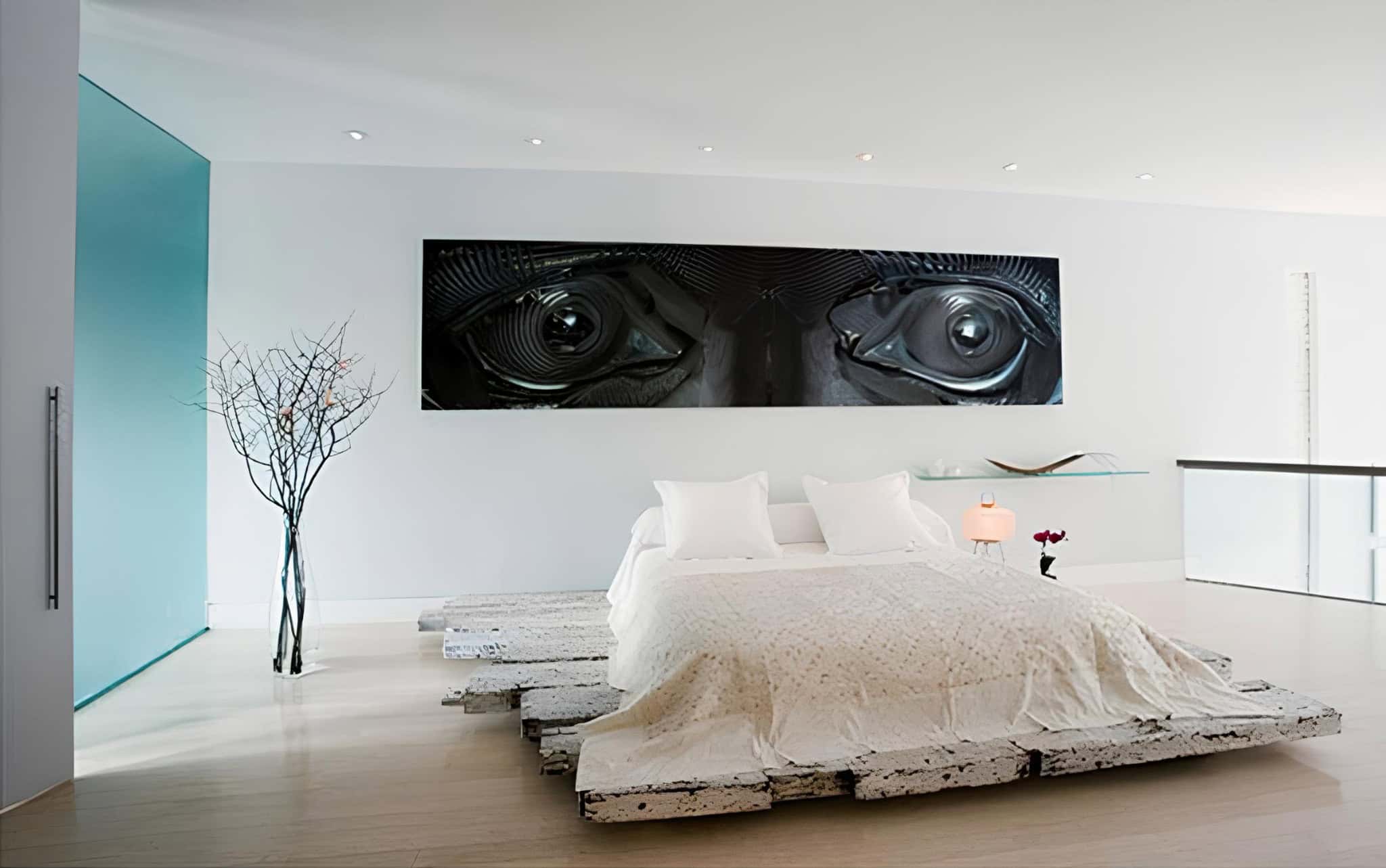 Low-profile pallet bed in distressed white, perfect for a modern minimalist bedroom.