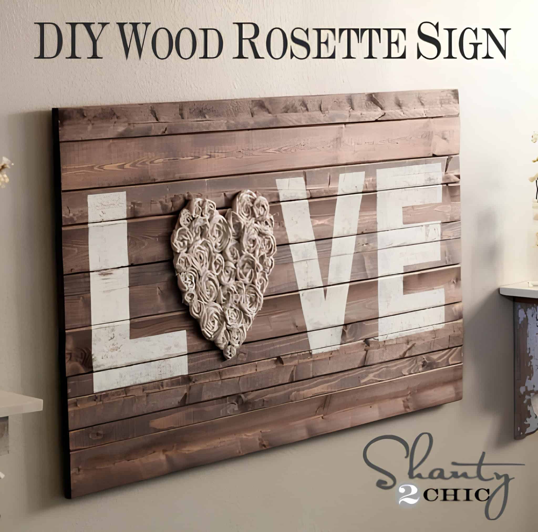 Wooden wall decor spelling 'LOVE' with a rosette heart for the letter O.