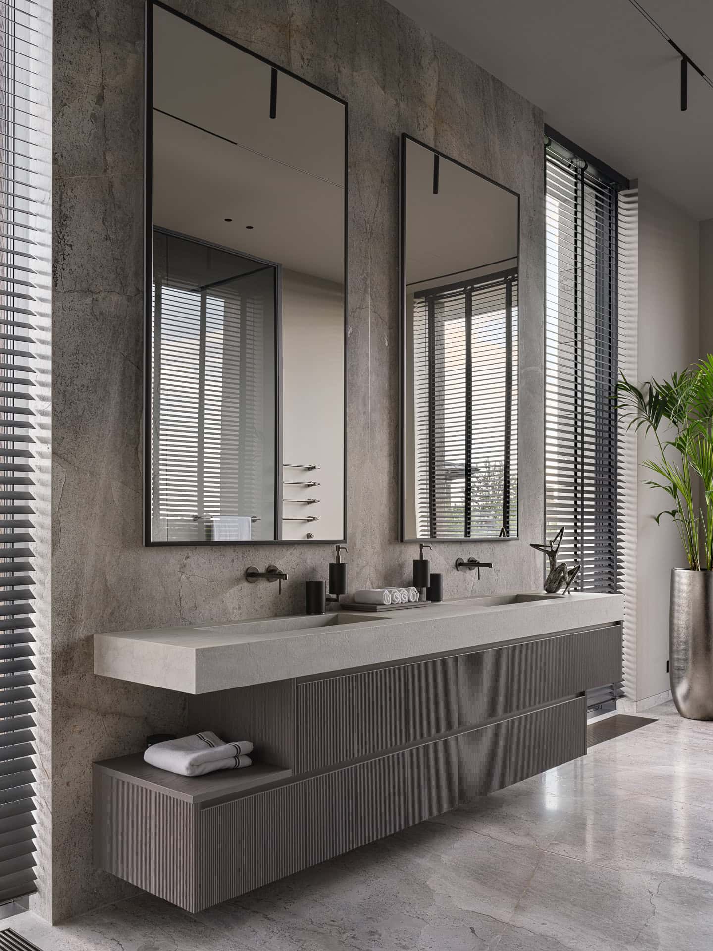 Double Vanity Mirrors in Modern Bathroom Dual vanity with large mirrors and minimalist design in a modern bathroom.