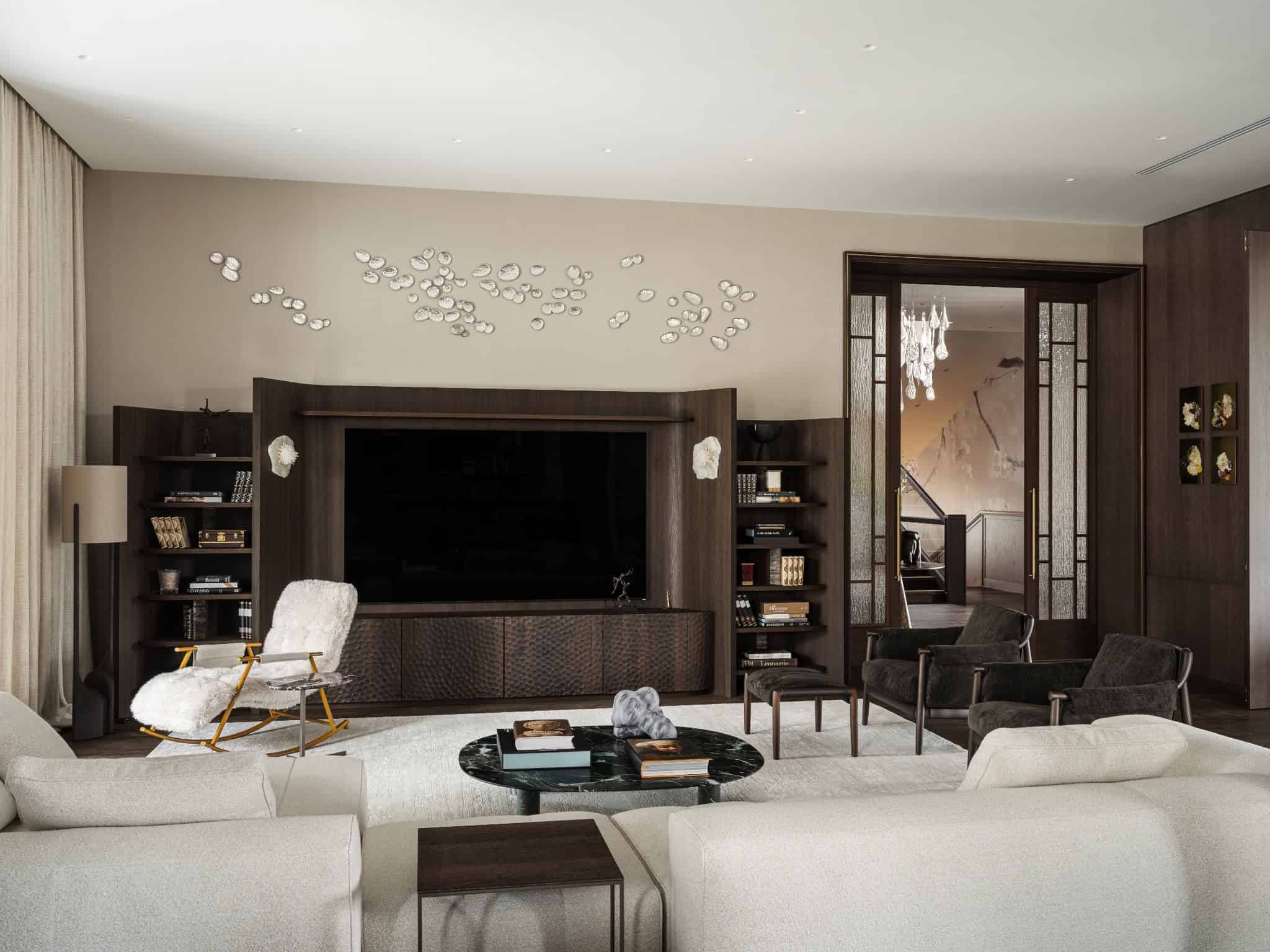 Elegant Living Room with TV Wall Unit Living room with custom dark wood TV wall and light upholstered furniture.