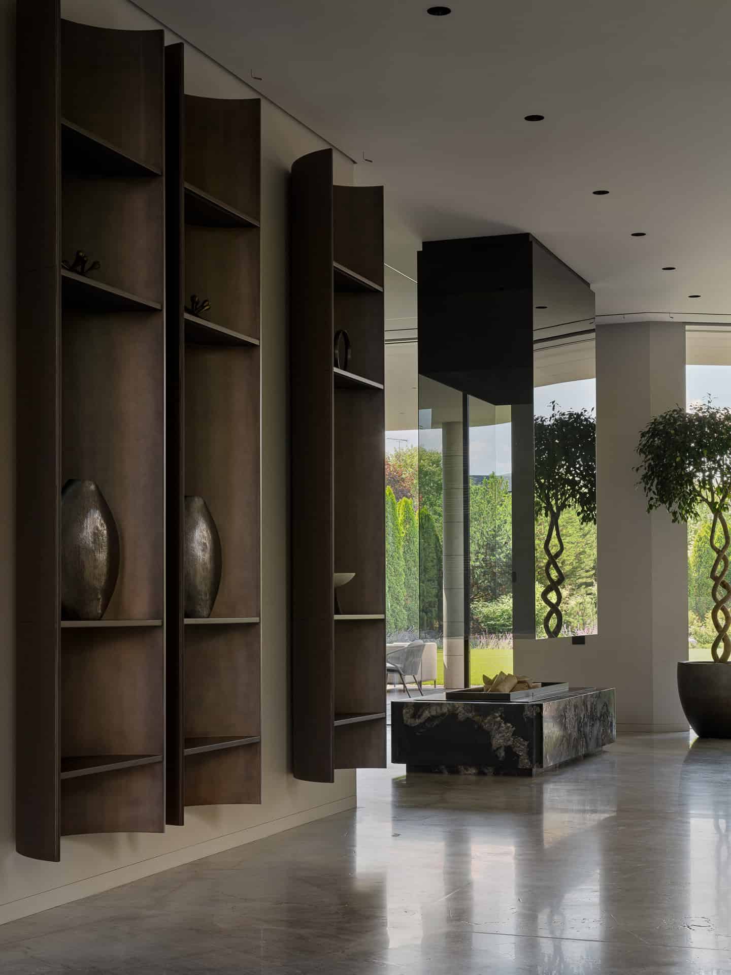 Floating Shelves and Garden View Minimalist interior with sculptural floating shelves and outdoor garden view.
