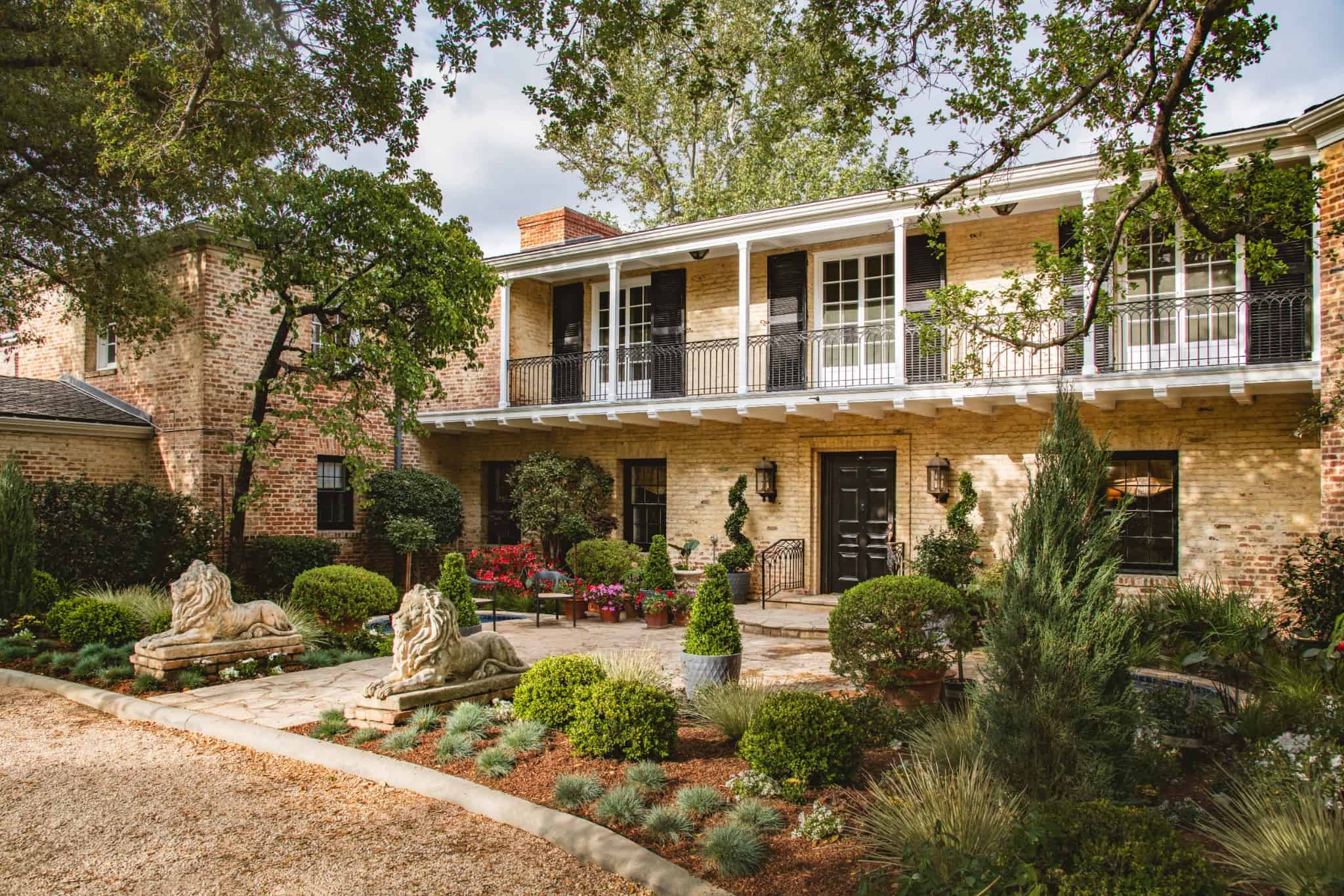 Fountain Garden Court Paths Statues TimothyJohn LA Lush garden court with symmetrical plantings and sculptural accents around a fountain.