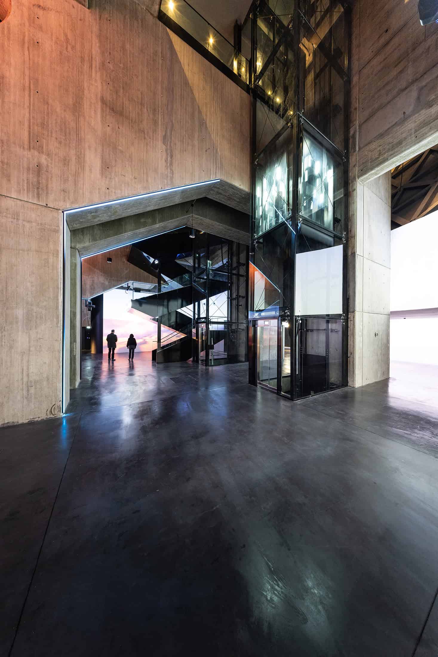 Geode Concrete and Glass Structure Structural details of La Géode with raw concrete and glass elevator.