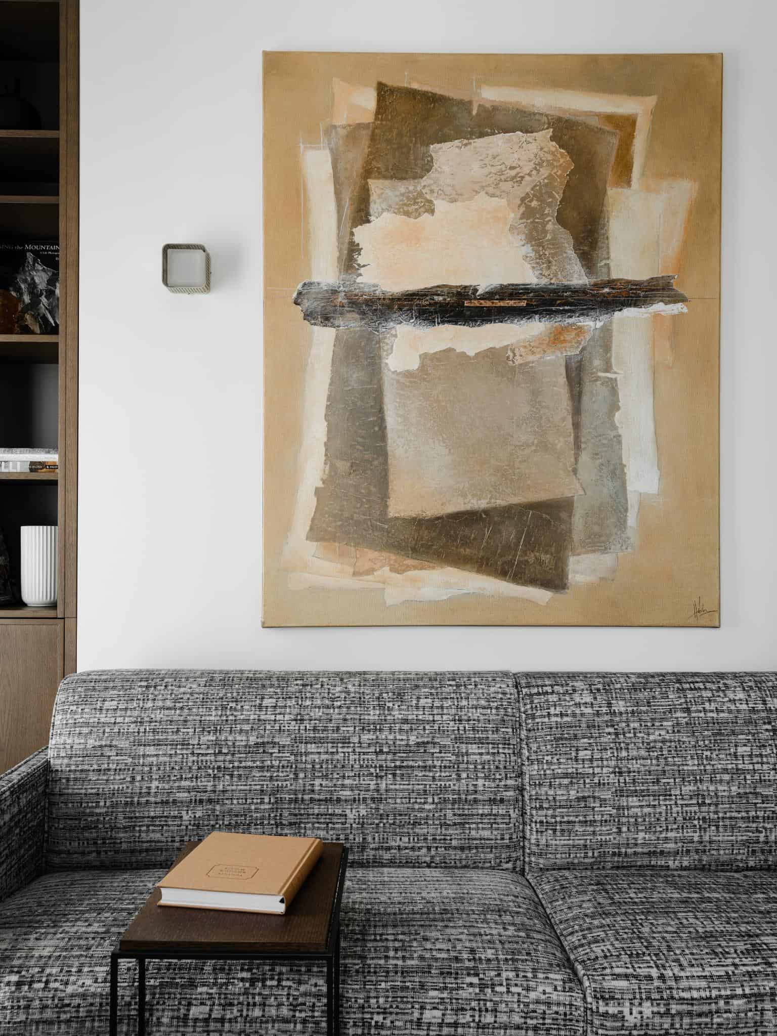 Gray Sofa And Textured Abstract Art Gray sofa and textured abstract art.