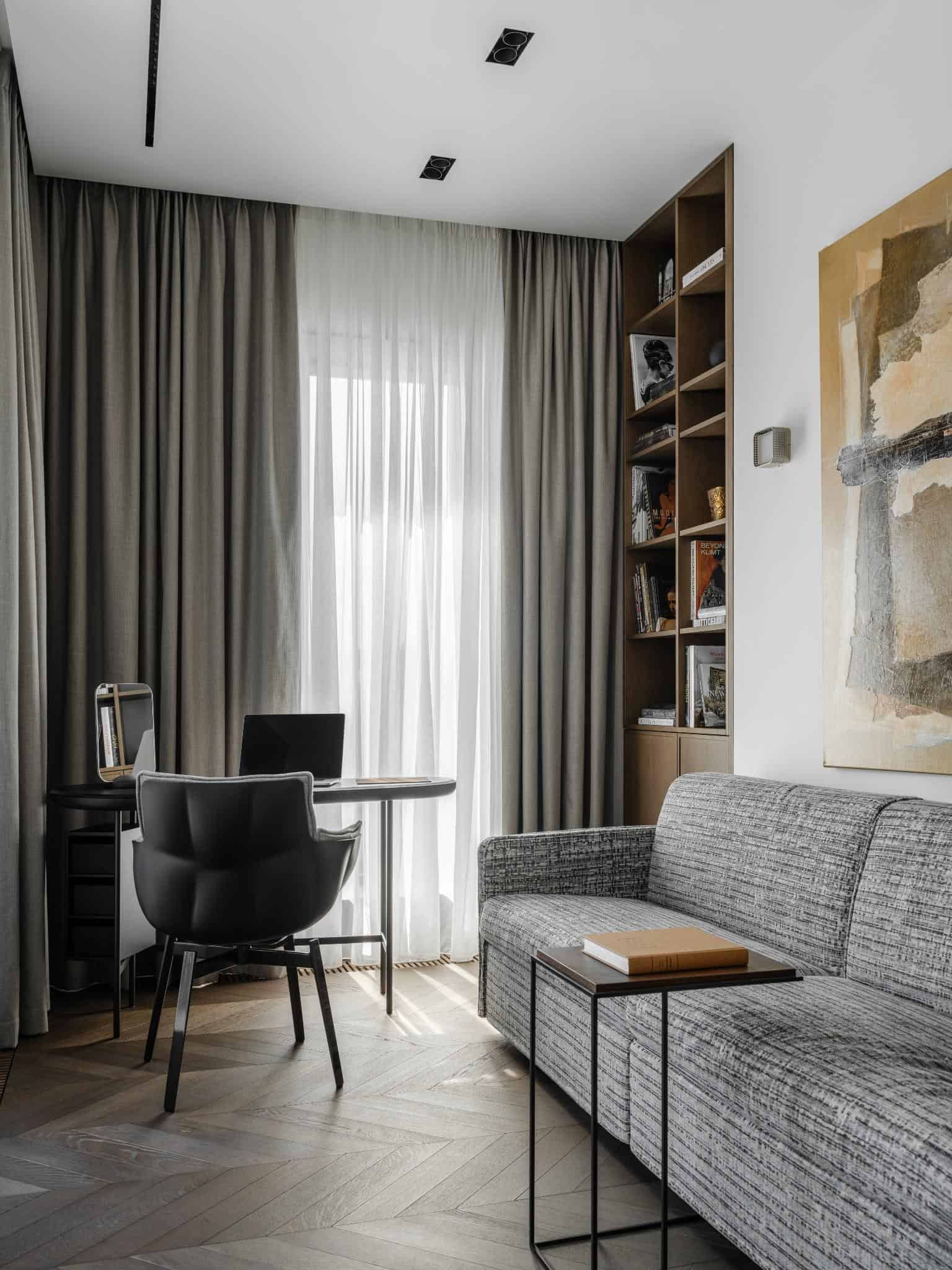 Home Office With Gray Curtains And Bookshelf Home office with gray curtains and bookshelf.