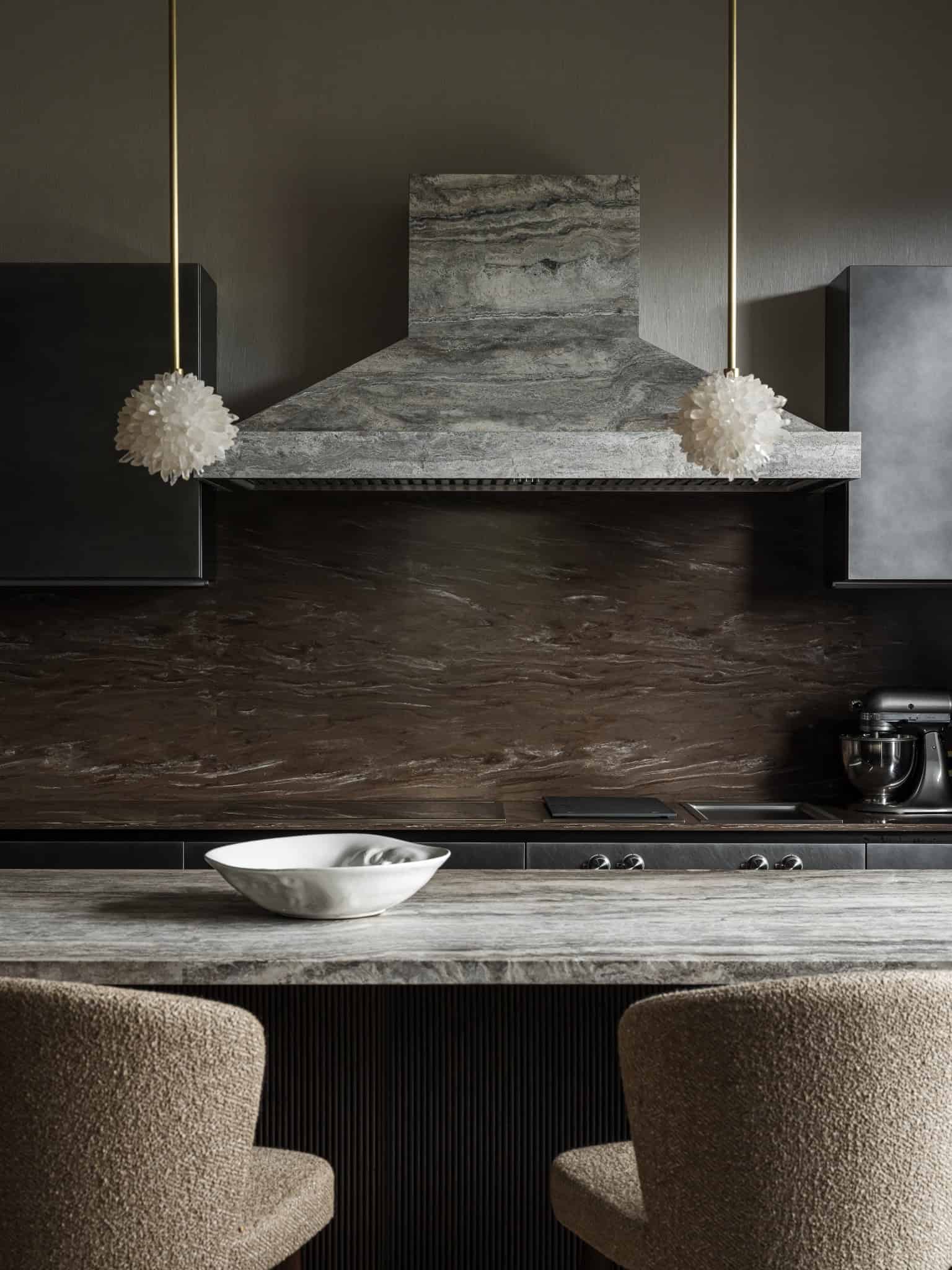 Kitchen Island and Hood in Natural Stone Textured stone kitchen hood and island with soft modern lighting.