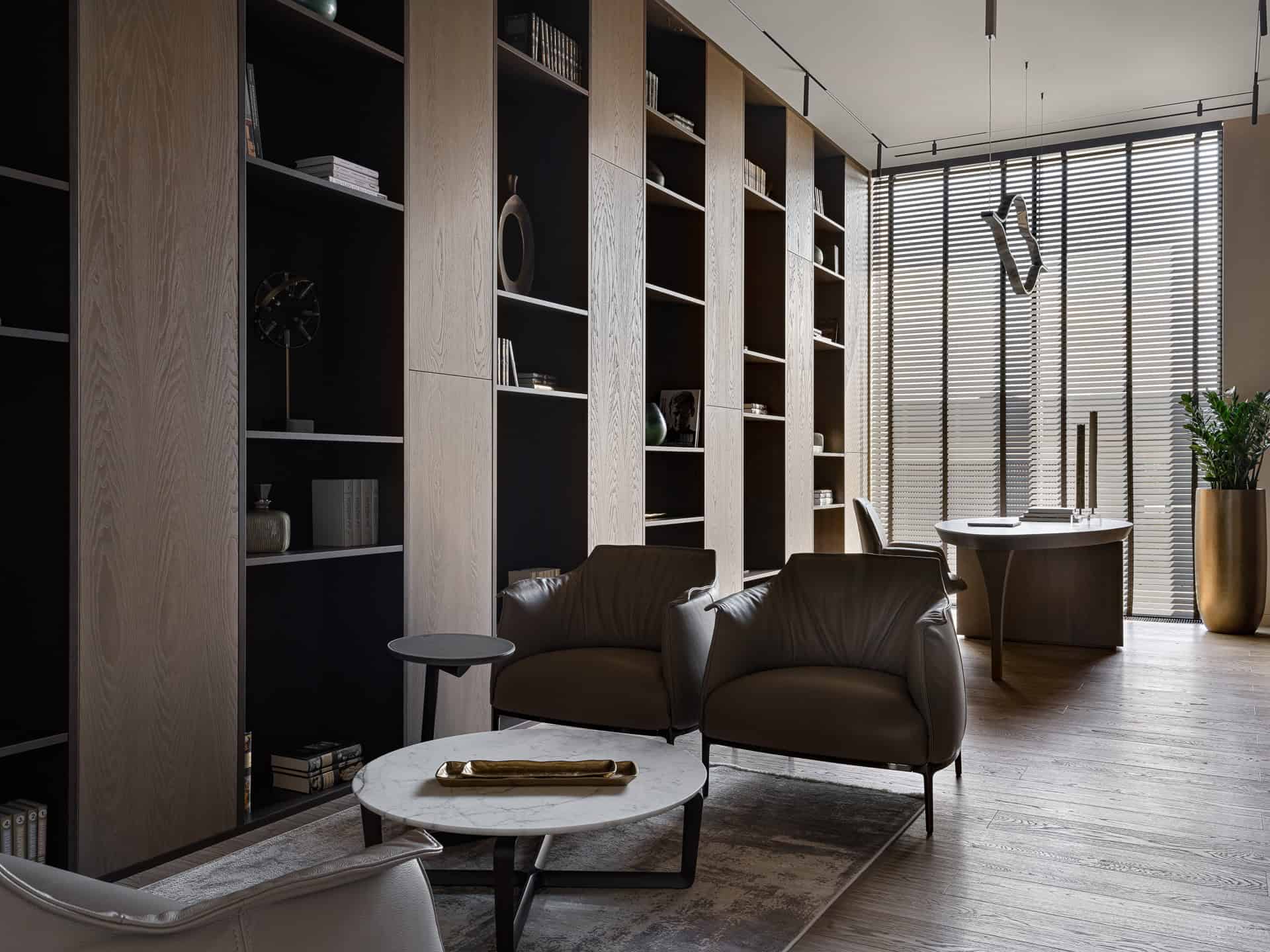 Library Seating Area with Natural Light Sophisticated library interior with tall bookshelves and natural light.