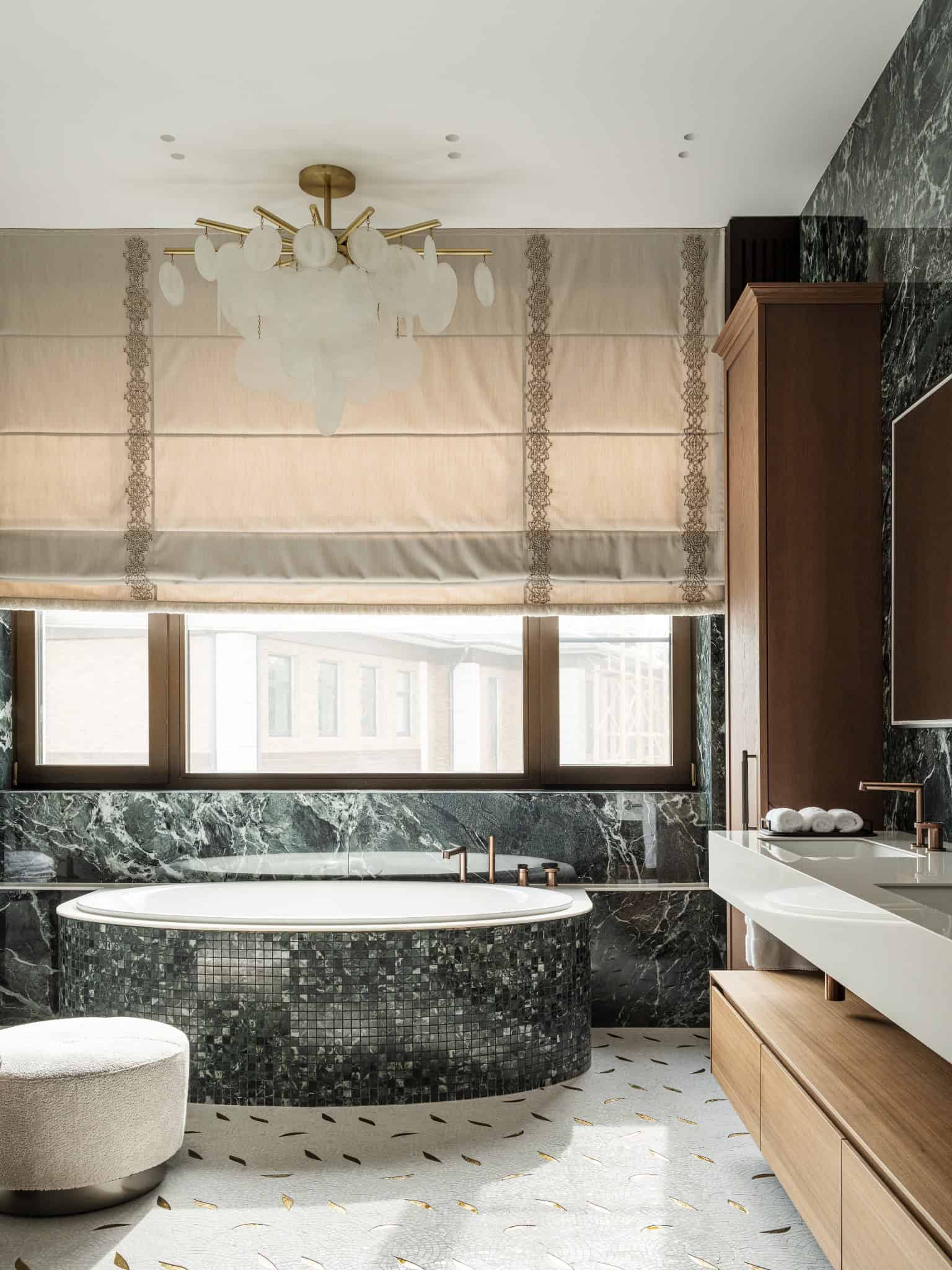 Luxurious Bathroom with Round Tub and Roman Blinds Spa-like bathroom featuring round mosaic bathtub and elegant window shades.