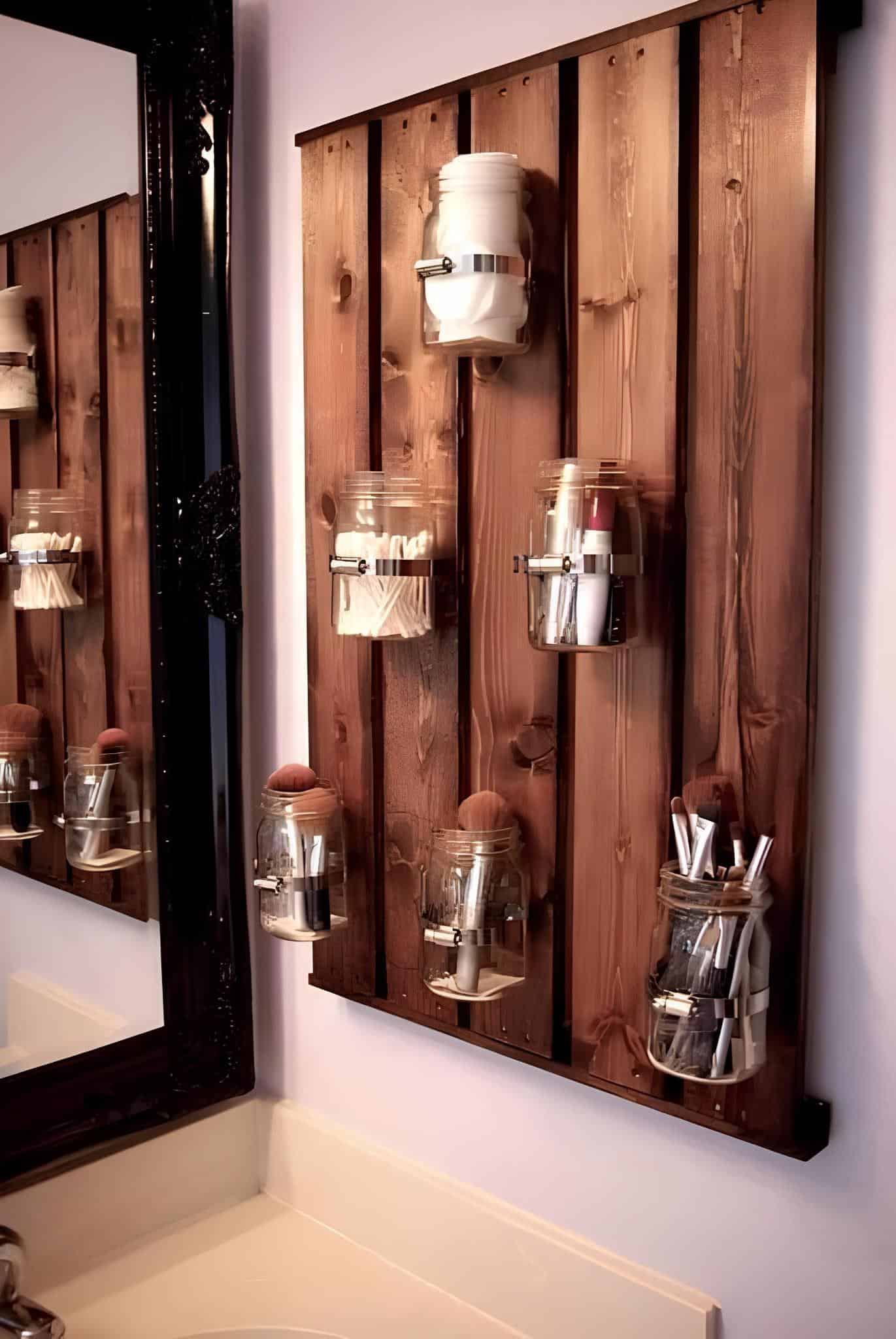 DIY bathroom storage made with mason jars mounted on a rustic wood panel