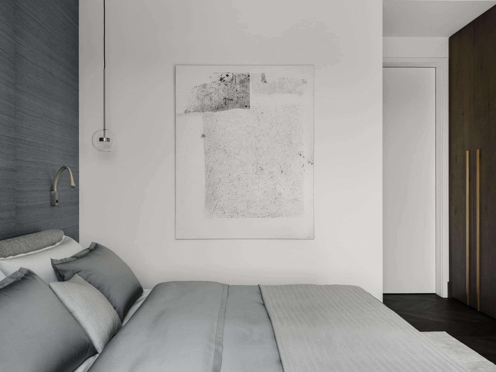 Minimalist Bedroom With Gray Bedding And Art Minimalist bedroom with gray bedding and art.