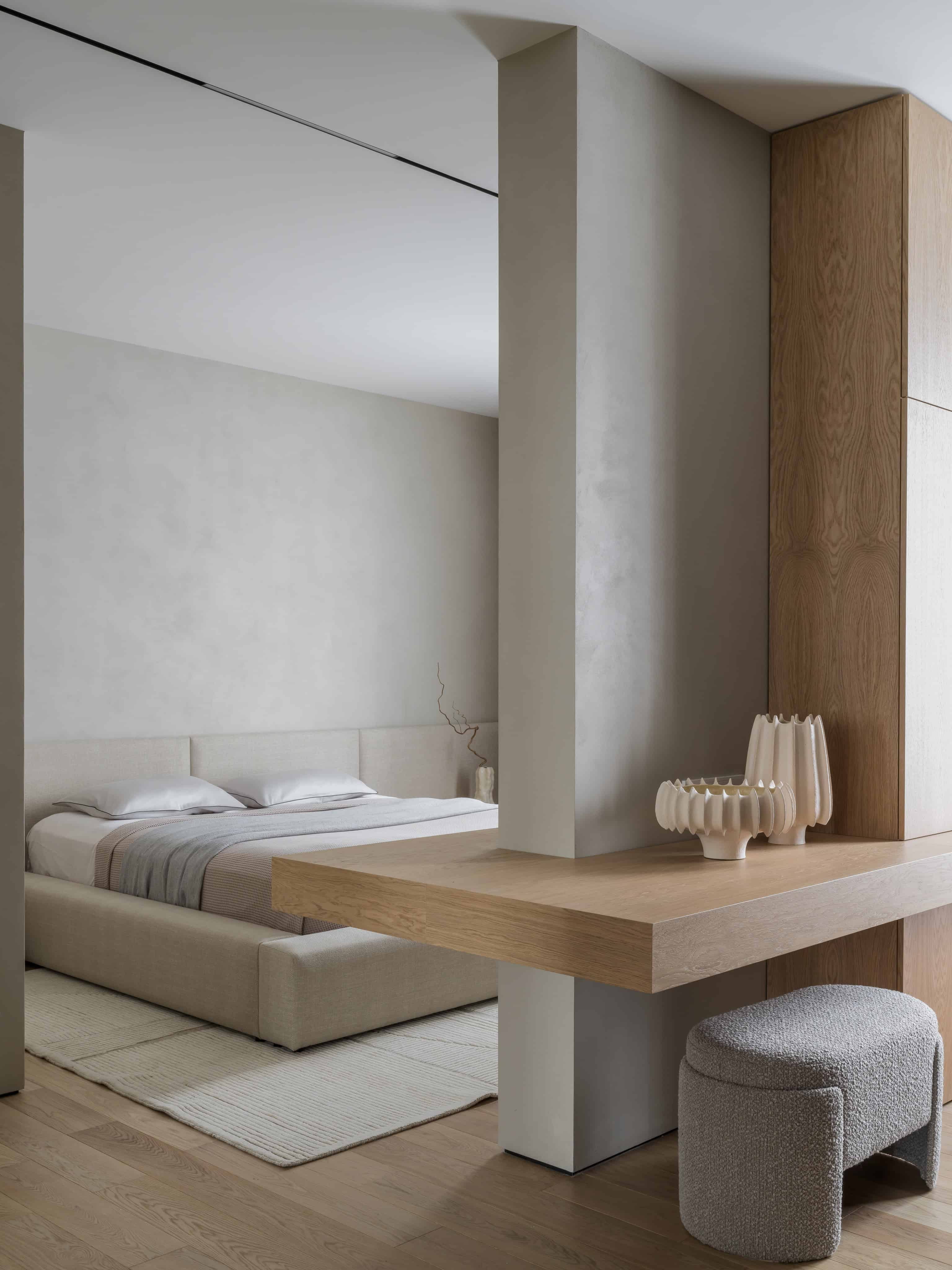 Minimalist Bedroom with Oak Vanity Minimalist bedroom design featuring a built-in oak vanity and soft neutral tones.