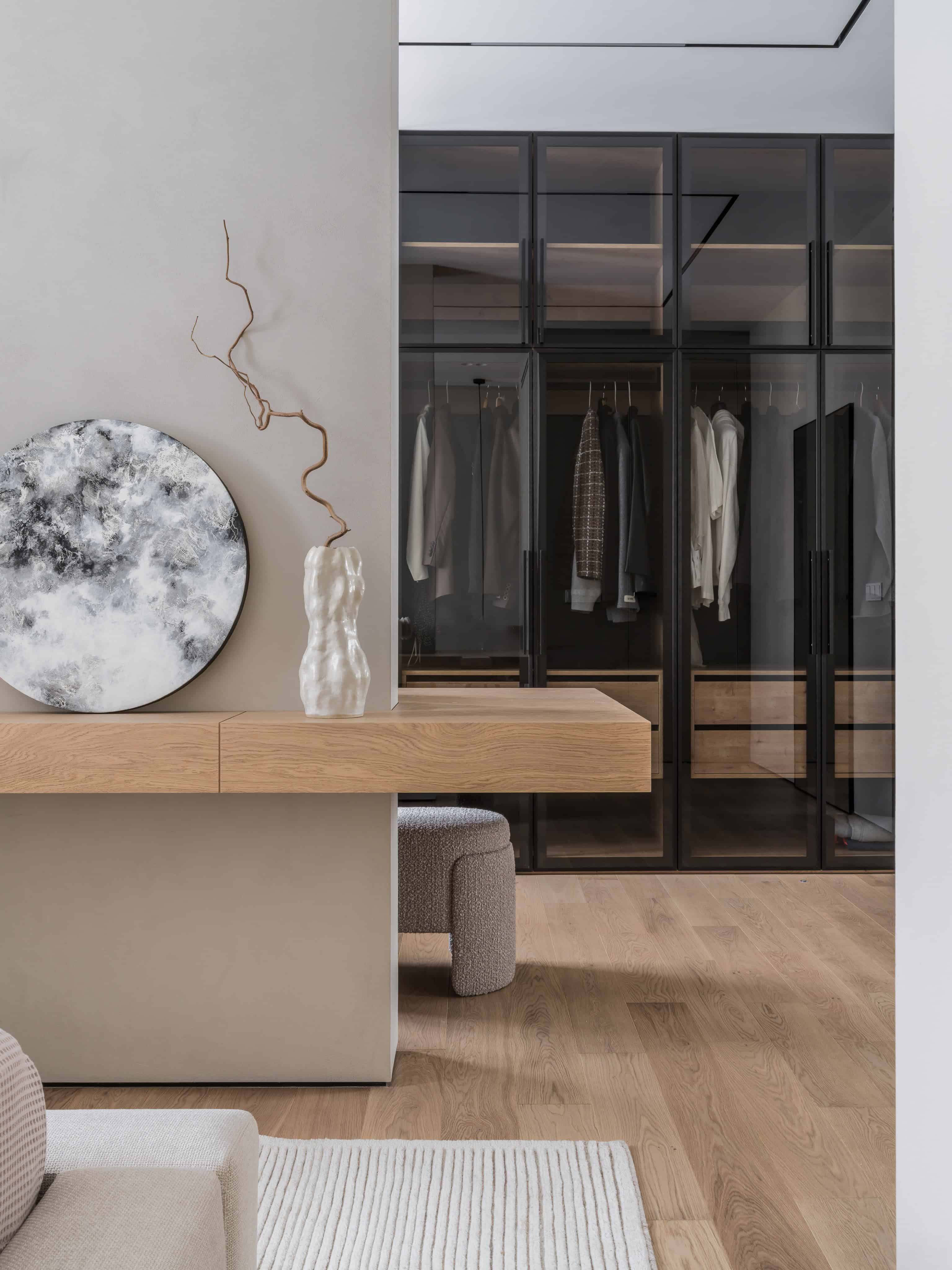 Mirror Reflection of Wooden Desk Artfully styled oak desk reflected in a tall floor mirror with natural lighting.