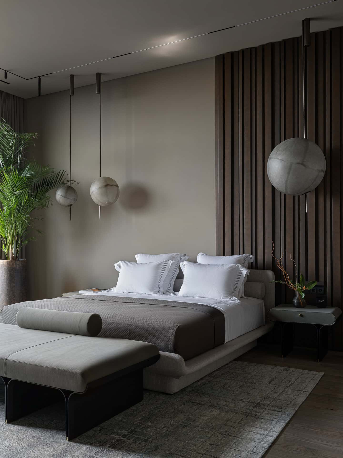 Modern Bedroom with Patio View Spacious modern bedroom with outdoor access and full-height windows.