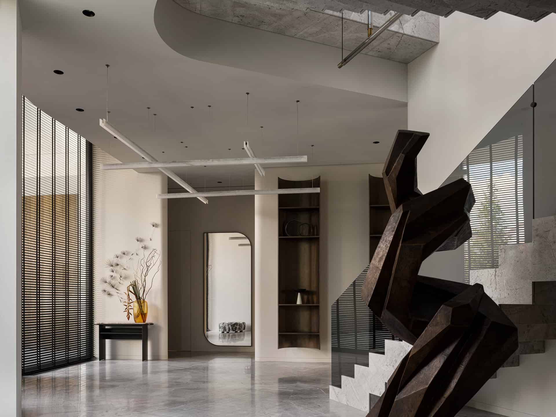 Modern Minimalist Staircase Sculpture Striking geometric sculpture on staircase in modern minimalist interior.