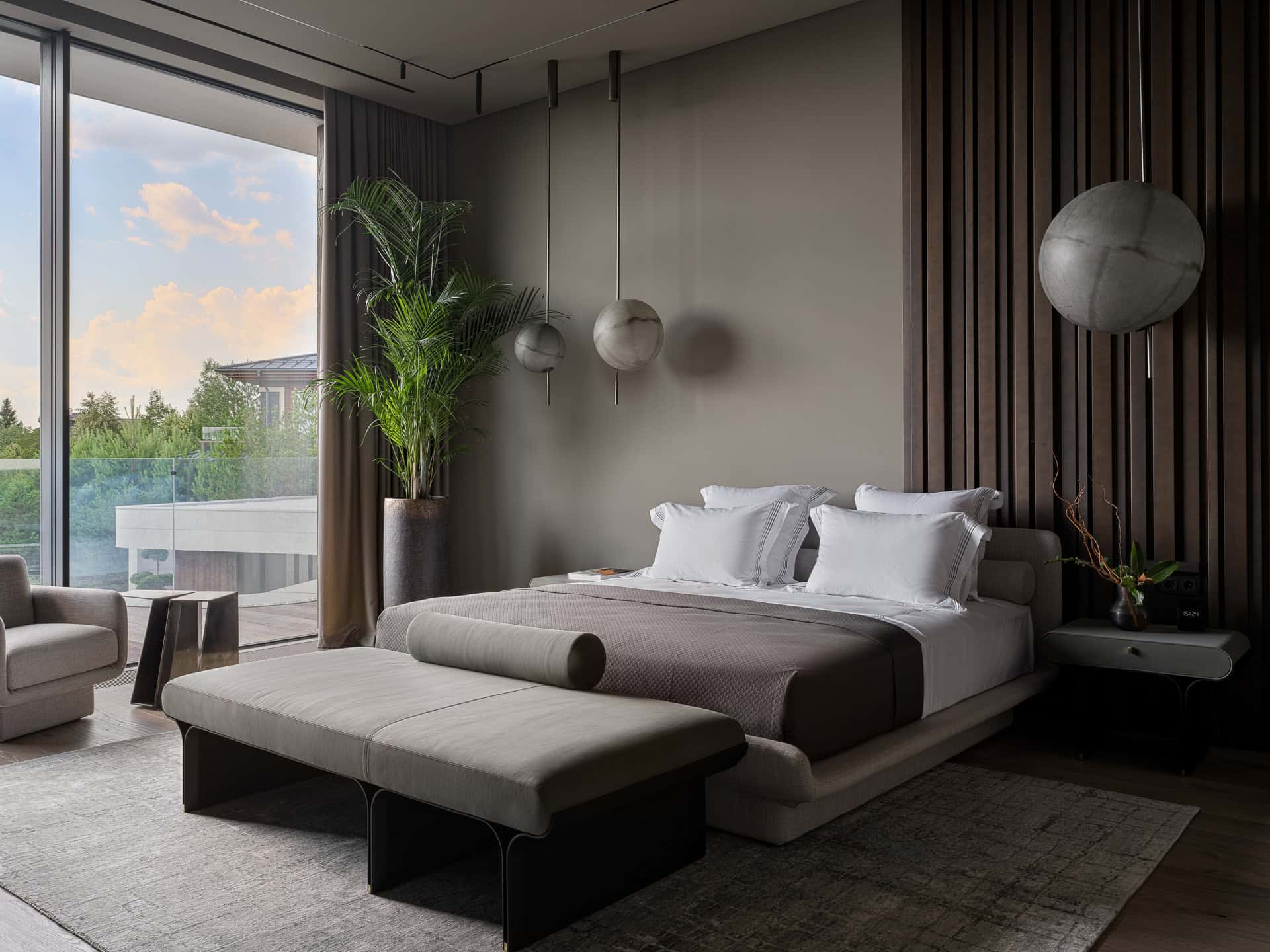 Neutral Bedroom with Suspended Globes Serene bedroom design with spherical pendant lights and neutral tones.