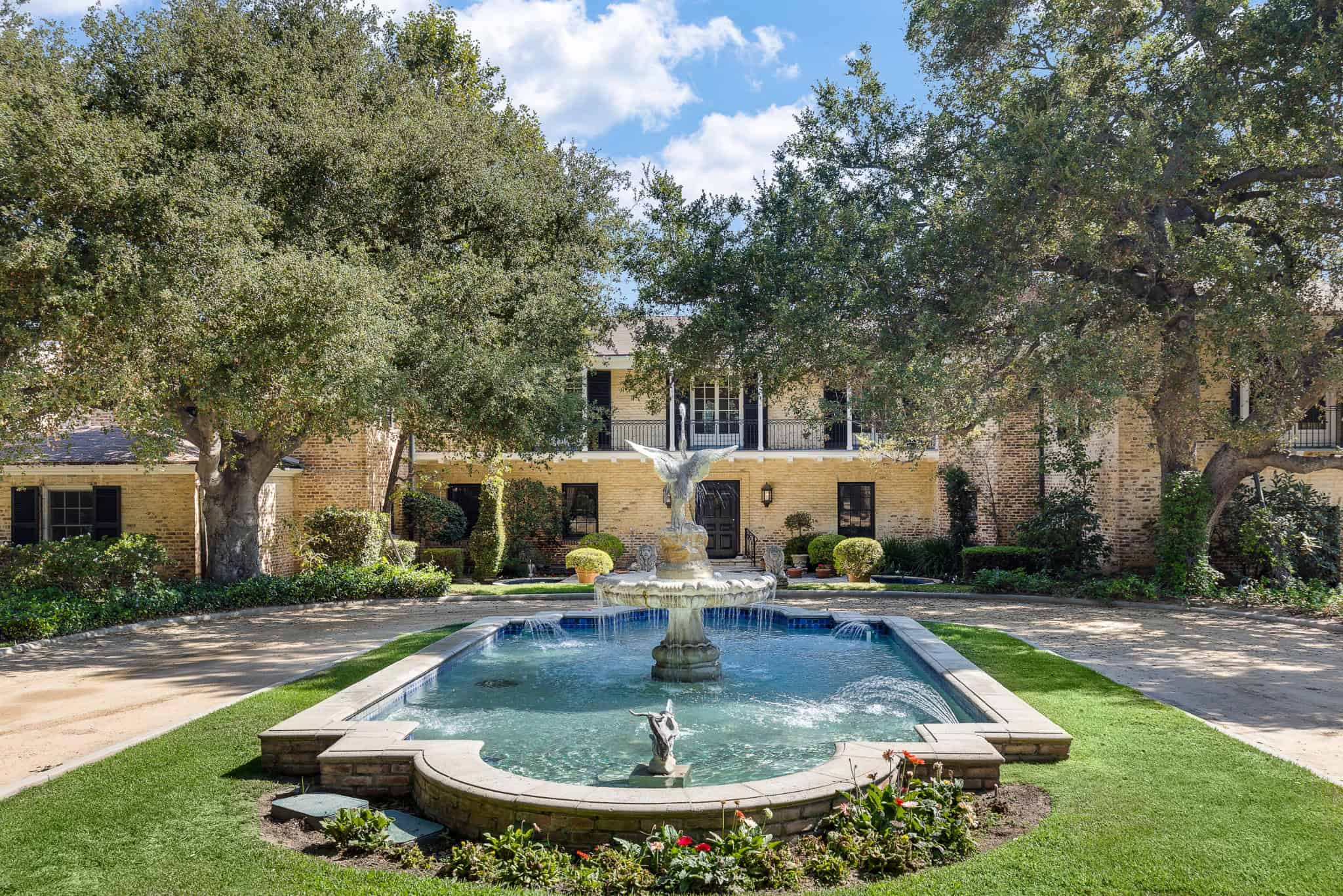 Pasadena Showcase House Front Fountain View Main fountain courtyard of the Pasadena Showcase House framed by oak trees and a circular drive.