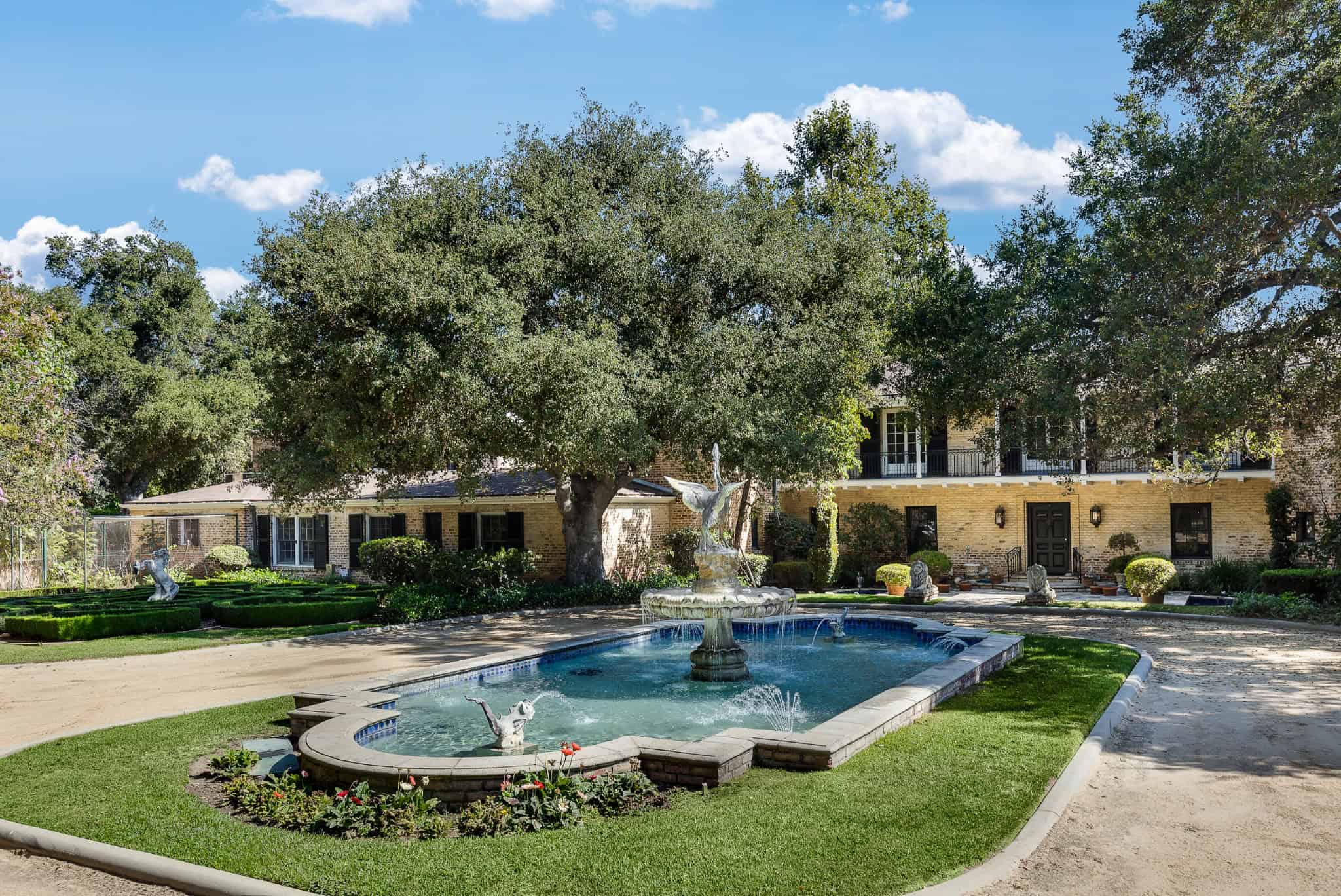 Pasadena Showcase House Wide Driveway View Expansive driveway leading to the Pasadena Showcase House with mature landscaping and symmetrical design.