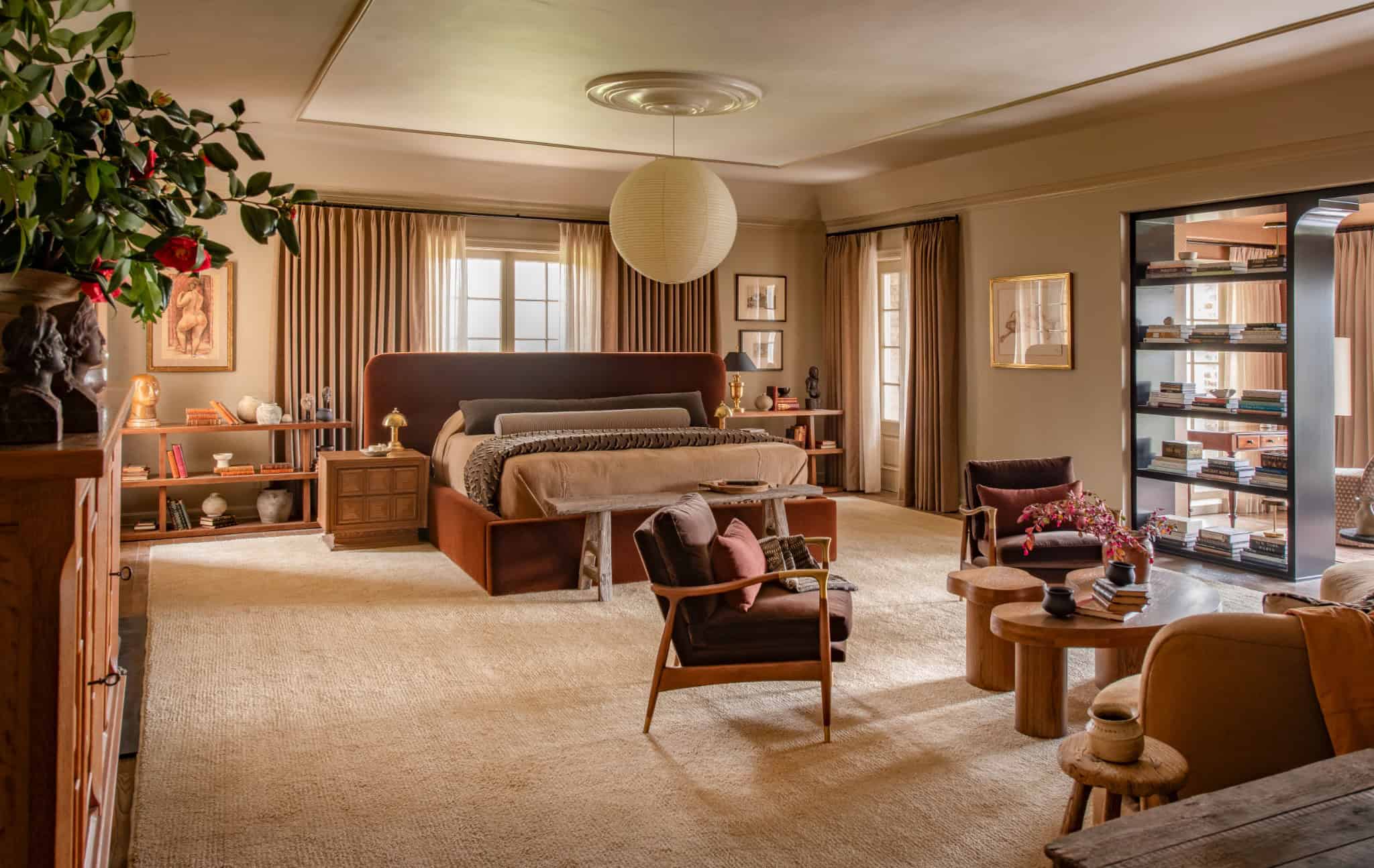 Primary Suite Lounge Space Plaster Patina Sitting area within the primary suite with soft lighting, wooden furniture, and cozy textiles.