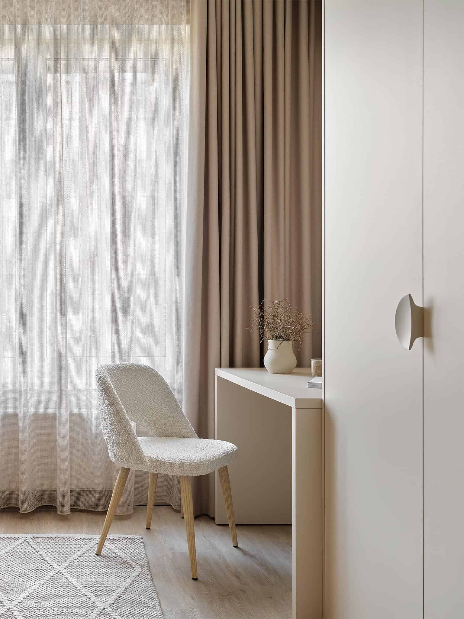 Scandinavian Style Desk with White Curtains Scandinavian style writing desk and chair with floor-to-ceiling white curtains.