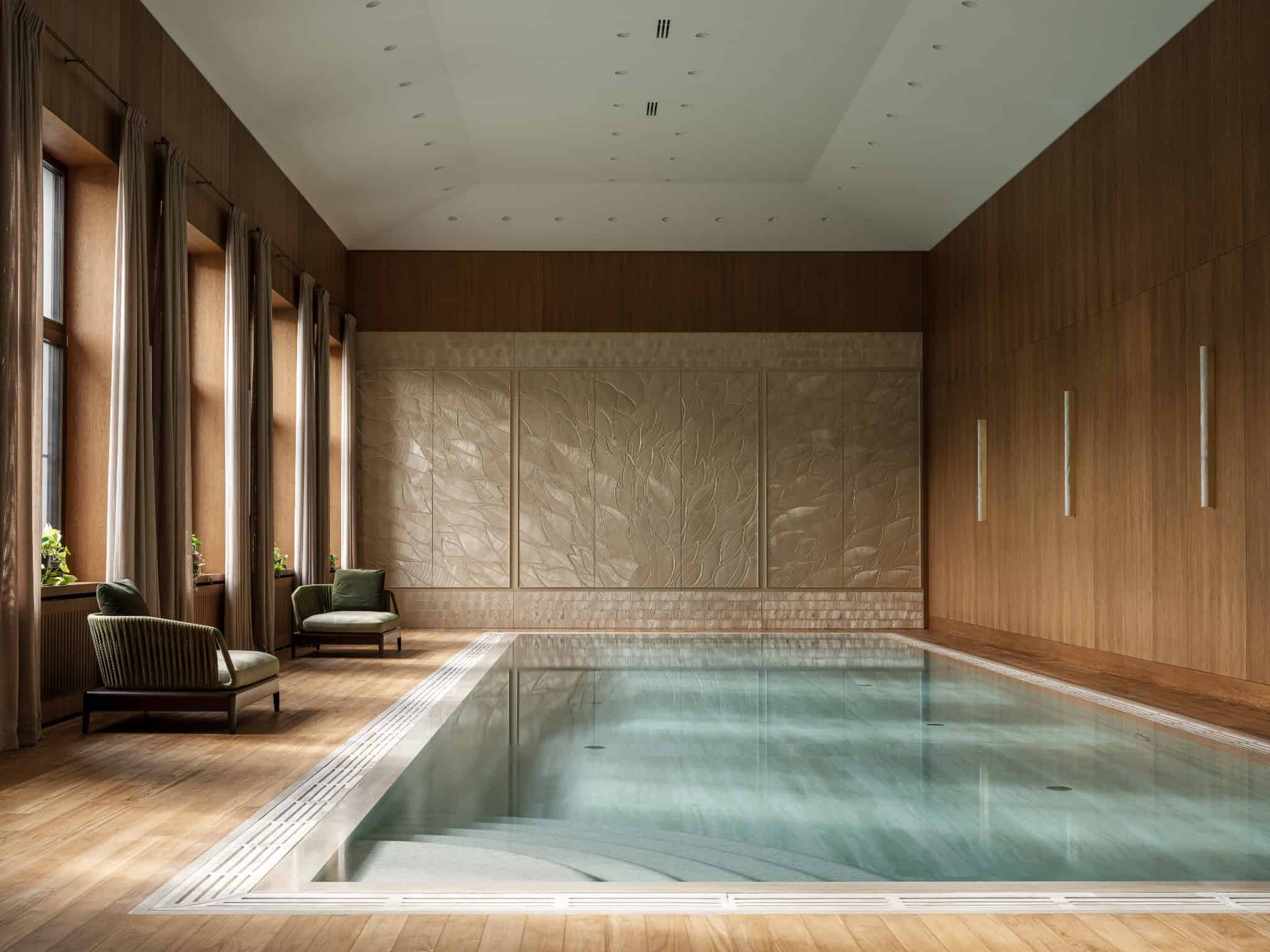 Spa Pool Room with Sculptural Wall Indoor spa pool room with textured relief wall and full-length windows.