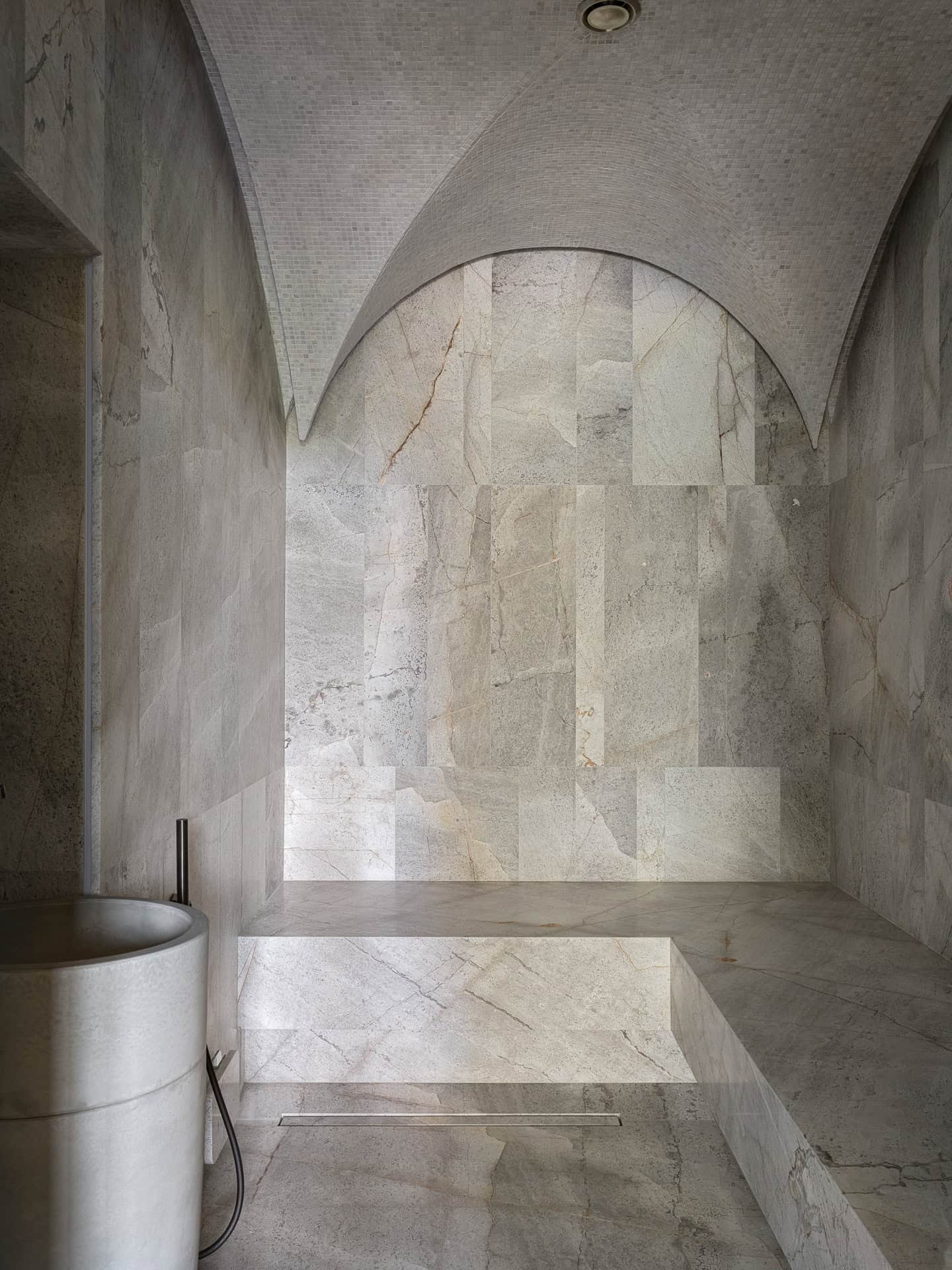 Spa Room with Arched Tiled Ceiling Spa or steam room with arched mosaic ceiling and stone tiled interior.