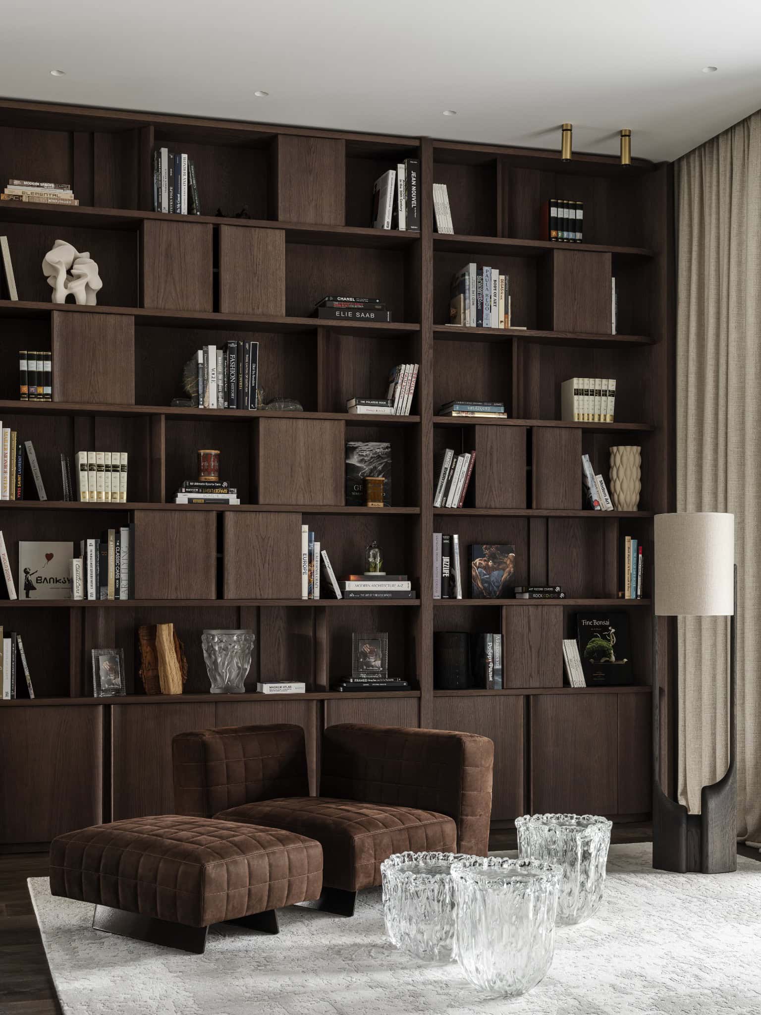 Stylish Reading Nook with Modern Chairs Brown suede chairs paired with glass stools in a cozy reading corner.