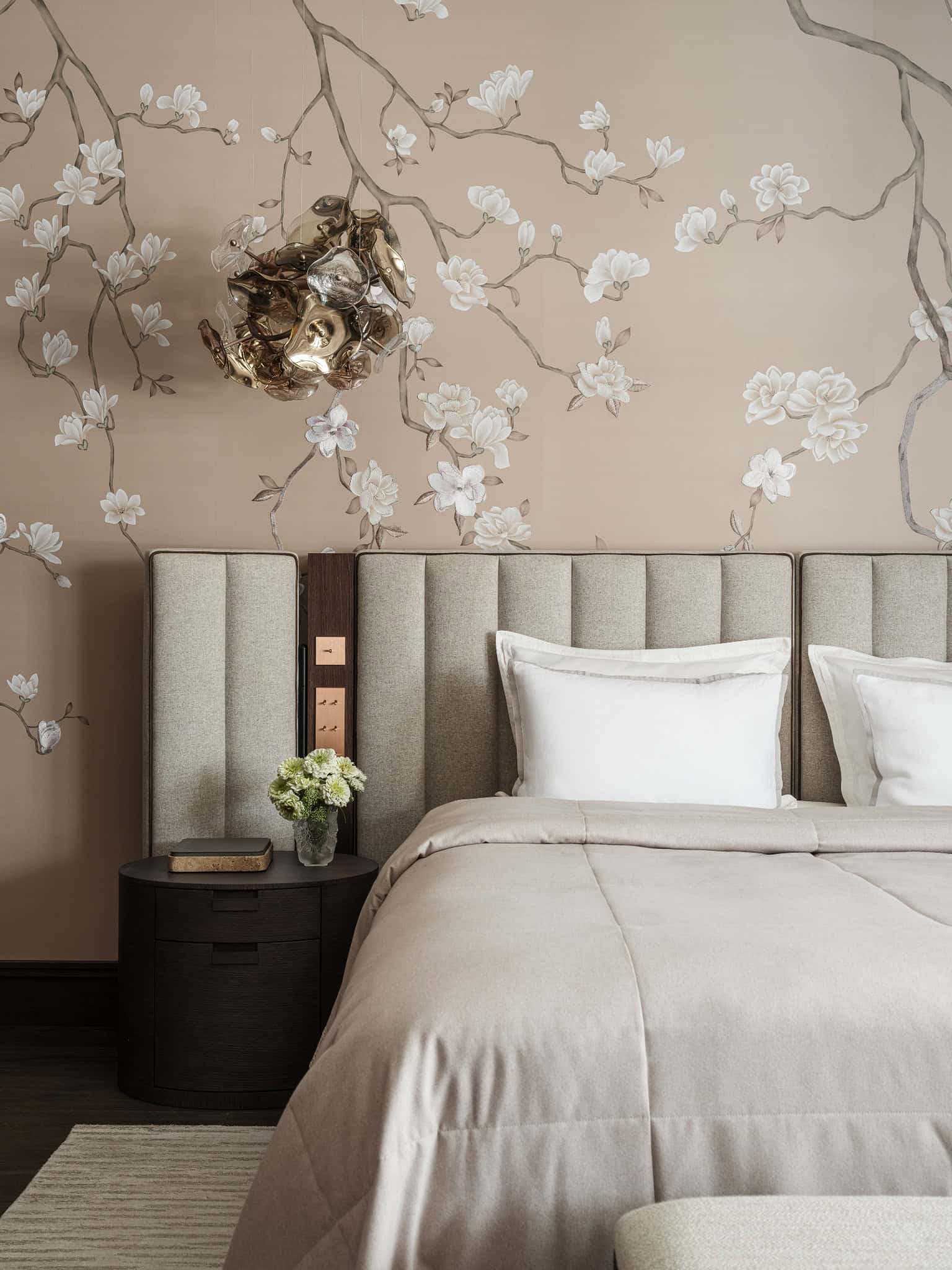 Textured Wall Behind Modern Headboard Detailed floral mural decor behind contemporary upholstered bed.