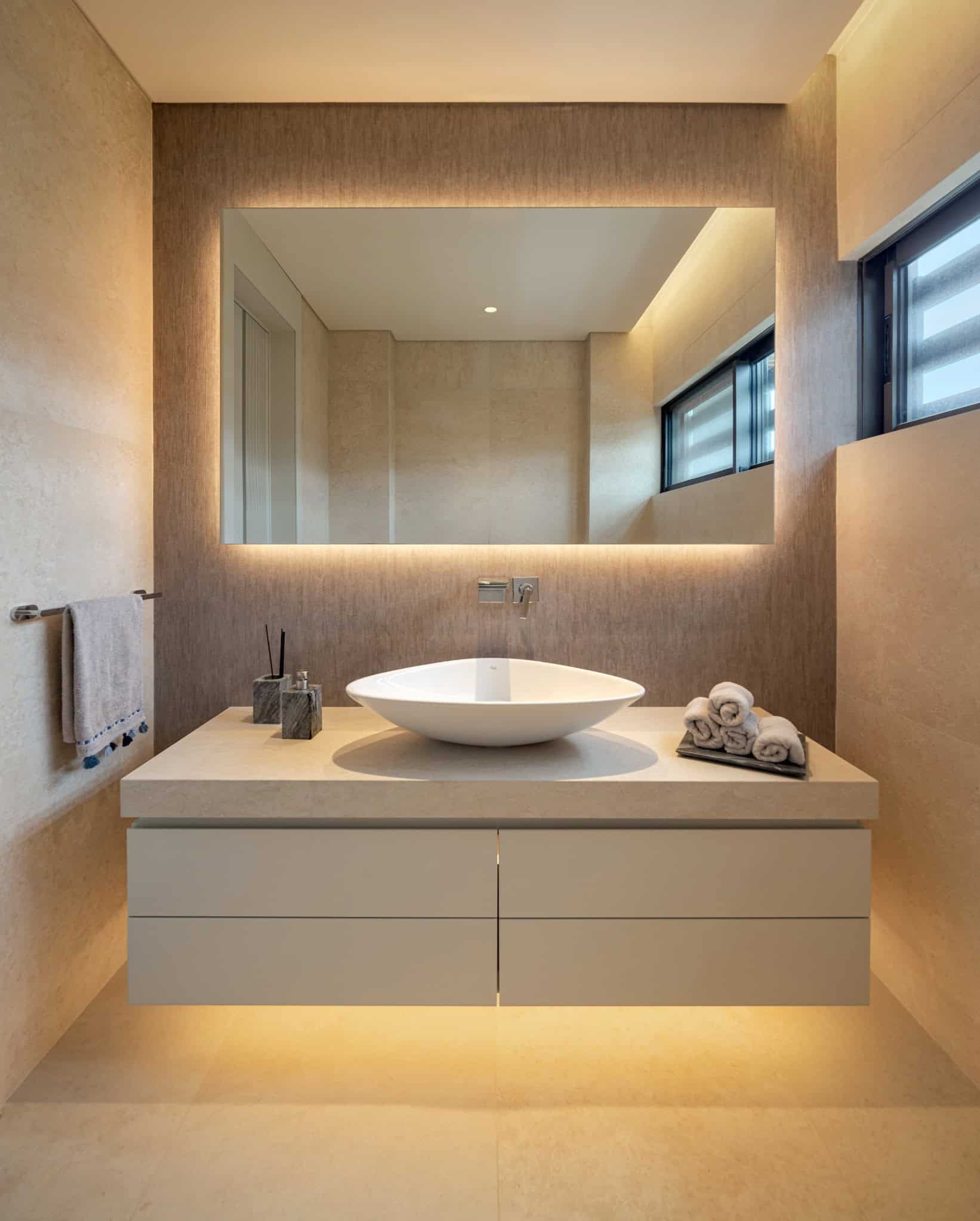 Casa Solis Bathroom with Backlit Mirror Elegant bathroom at Casa Solis featuring a vessel sink and a backlit mirror.