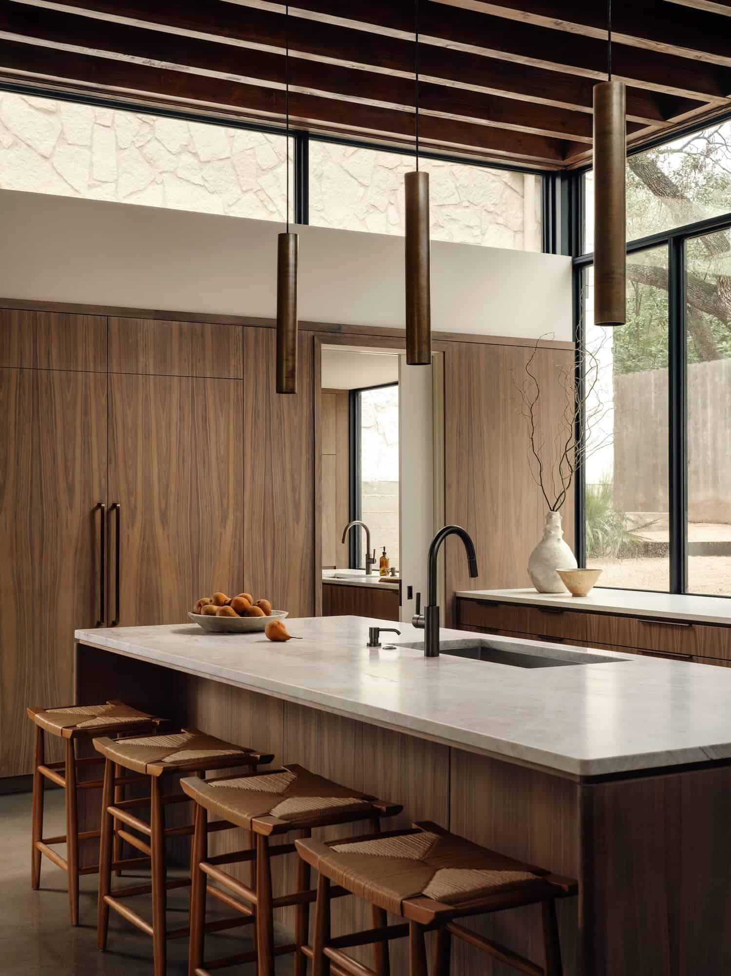 Casa Solis Built-in Shelf Decor and Books Minimal built-in shelf at Casa Solis decorated with ceramics and books.