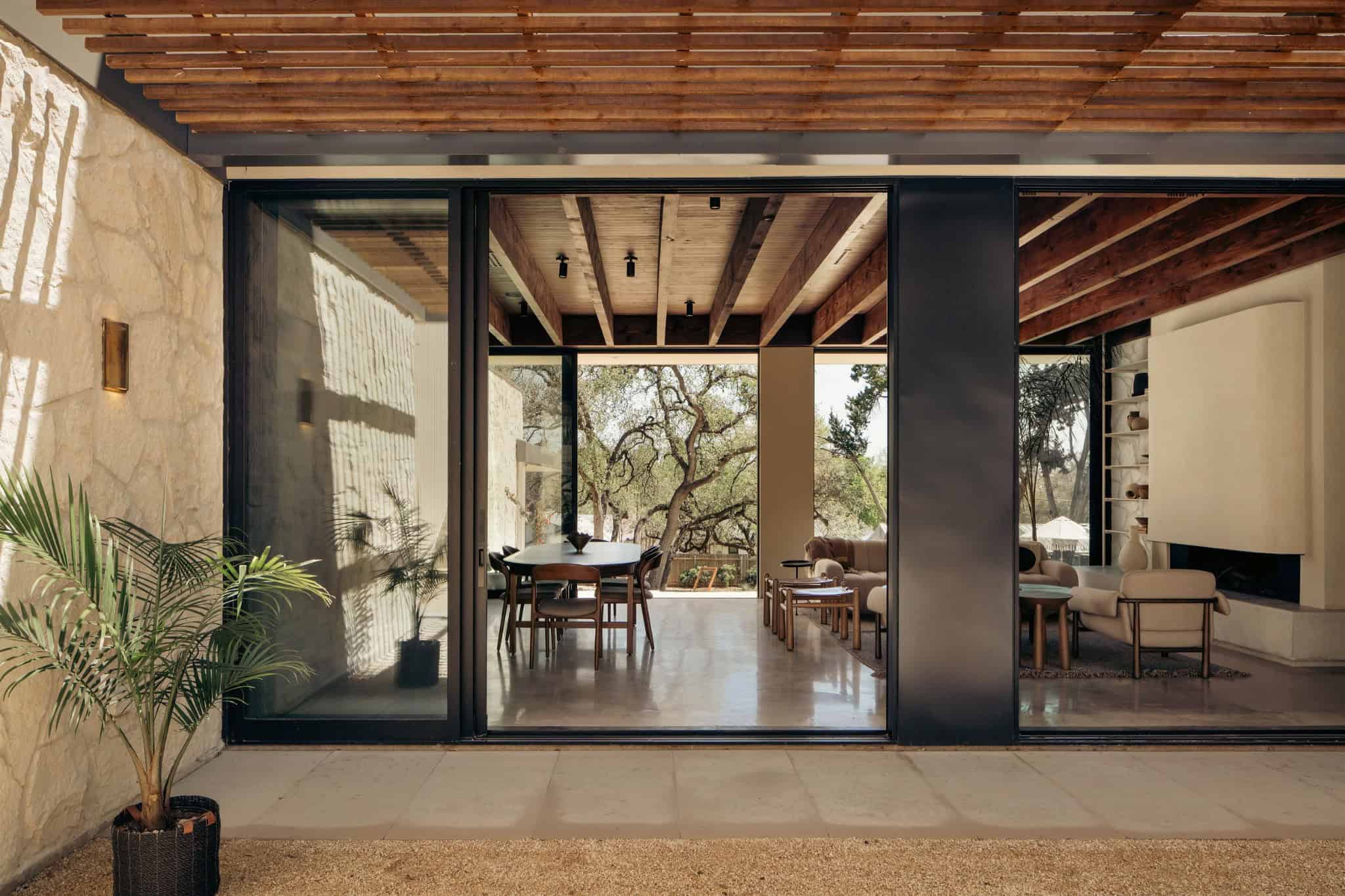 Casa Solis Pergola Patio Staircase Chairs Outdoor seating area at Casa Solis with pergola and vertical slatted stairs.