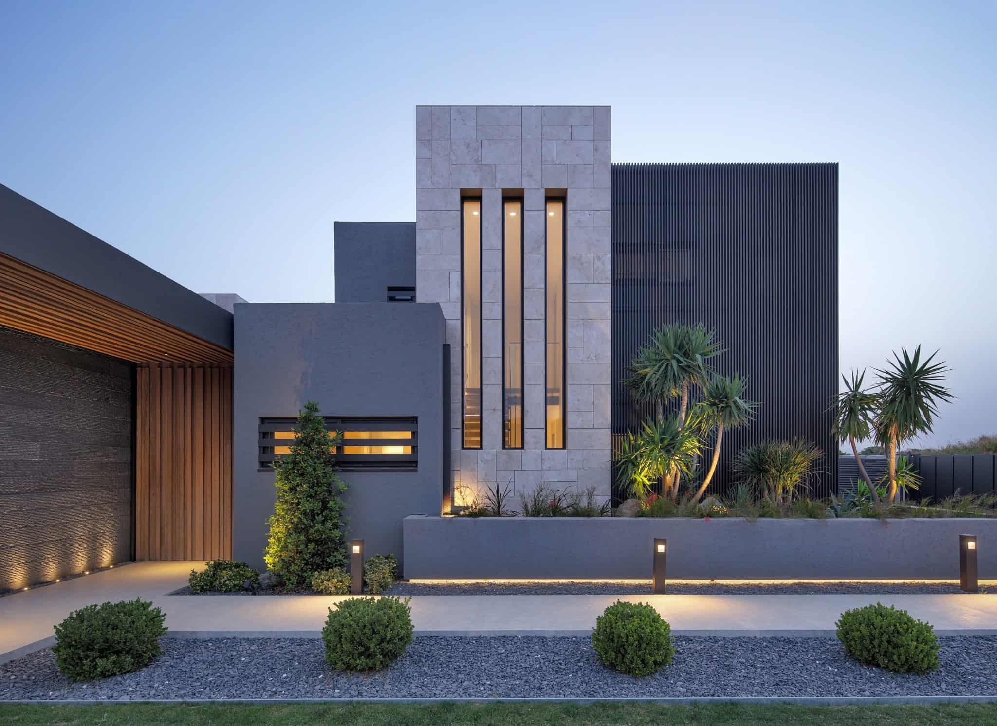 Contemporary modern house exterior with sleek architectural design, minimalist landscaping, and innovative use of materials, emphasizing modern architecture and landscape design.