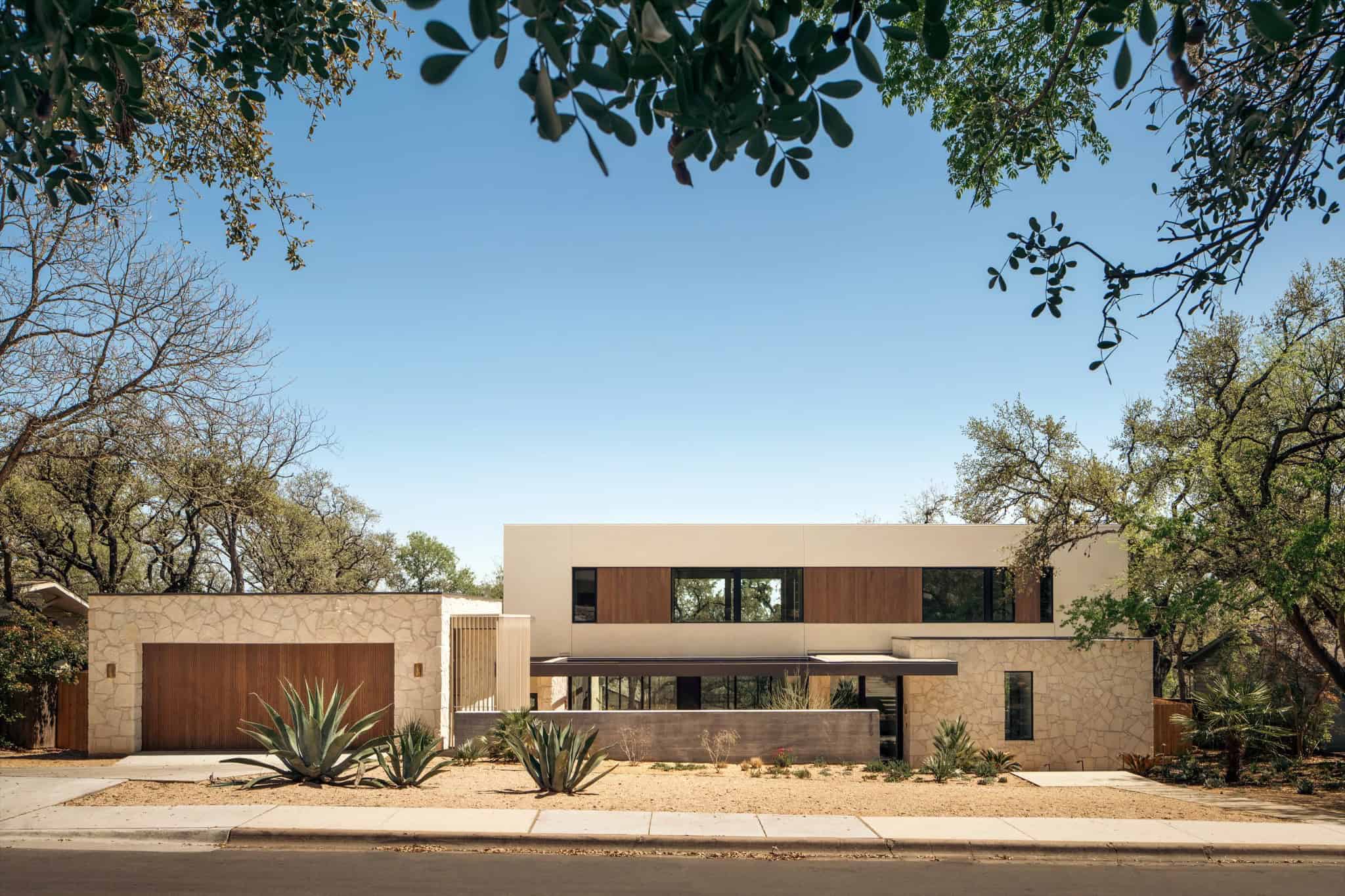 Casa Solis Street View Minimalist Façade Street-facing elevation of Casa Solis with clean lines and natural textures.