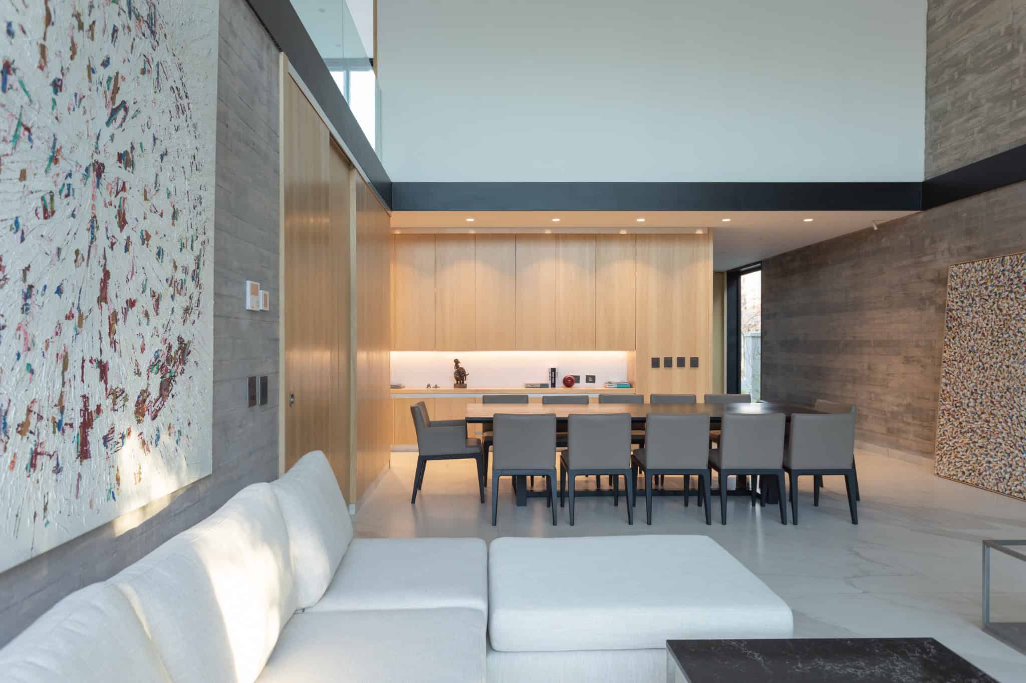 Double Height Dining And Shelving Area A4Estudio Casa EE by A4estudio - Double height dining and shelving area a4estudio