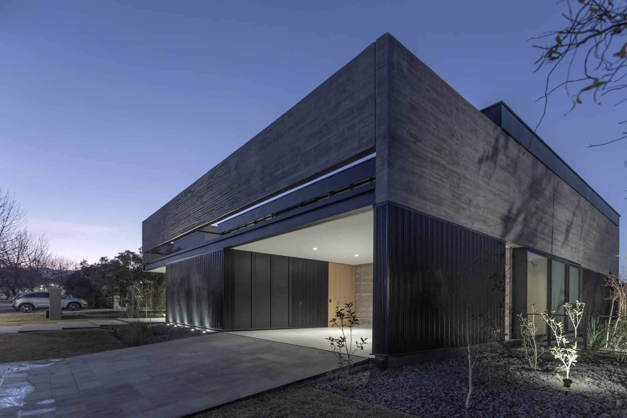 Garage Entry Concrete Home At Night A4Estudio Casa EE by A4estudio - Garage entry concrete home at night a4estudio