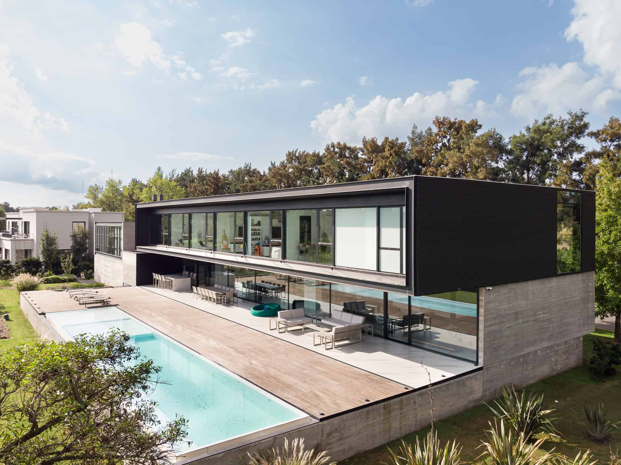 Pacheco House by A4estudio 04 Perspective view showcasing the terrace and cantilevered design.