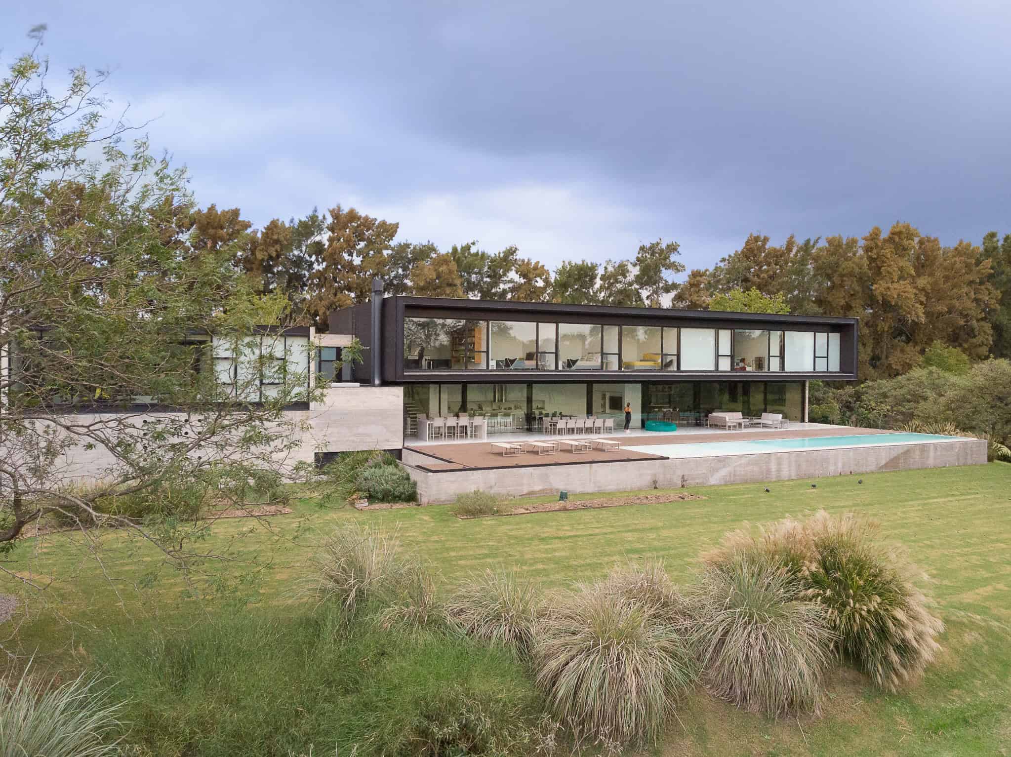 Pacheco House by A4estudio 06 Distant side view of Pacheco House with natural landscape.