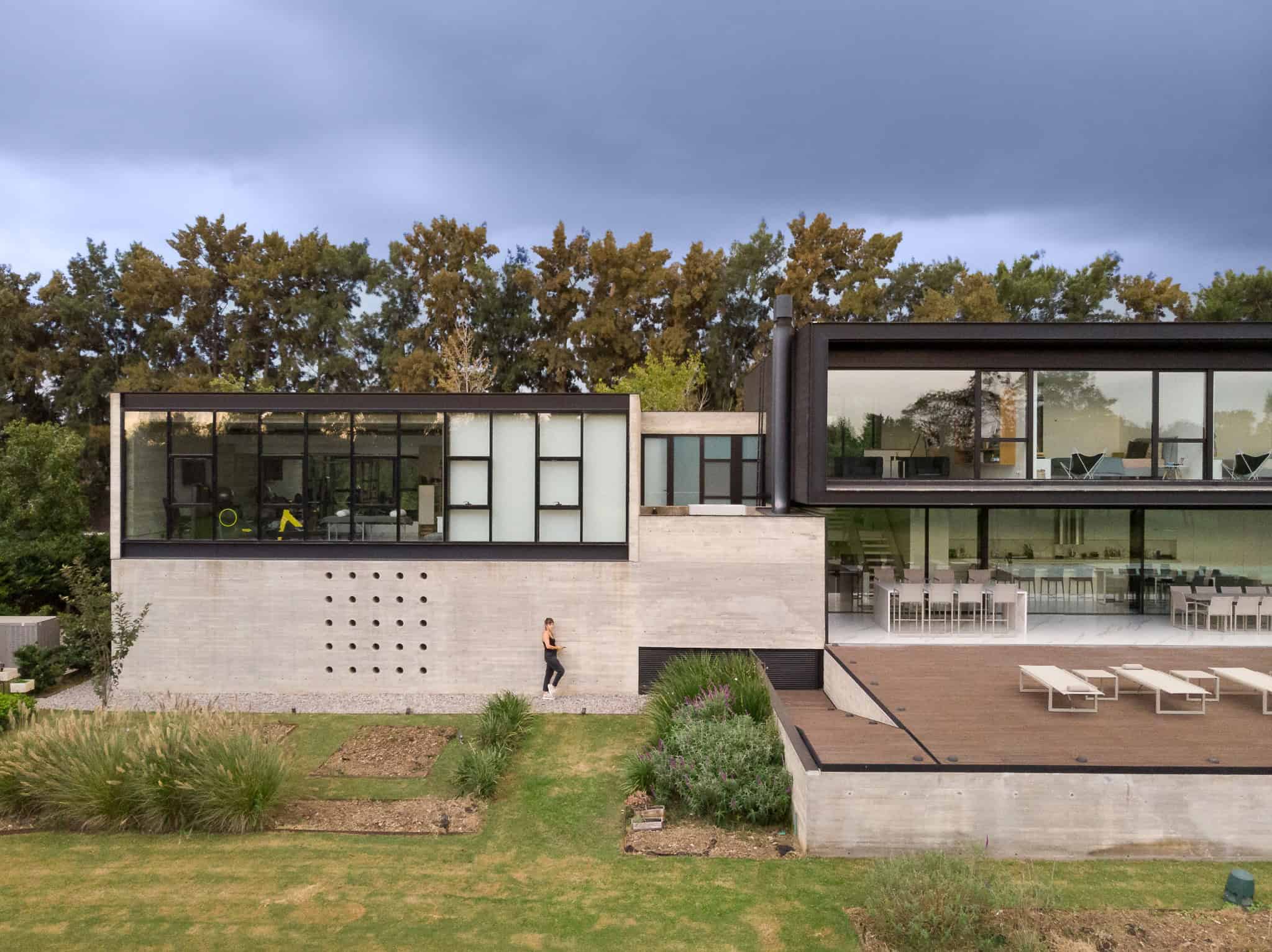 Pacheco House by A4estudio 08 Detail view of concrete and glass composition of the house.