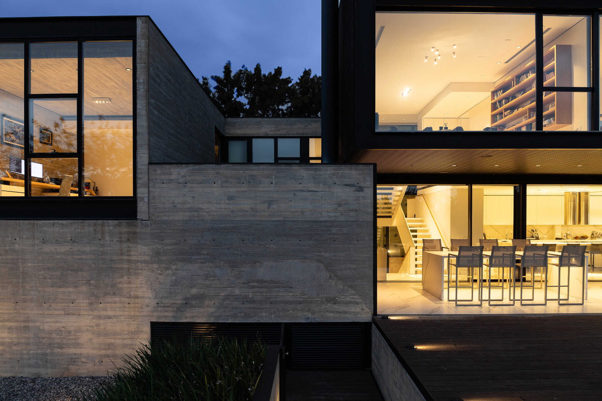 Pacheco House by A4estudio 13 Detail of staircase and kitchen through the illuminated façade.