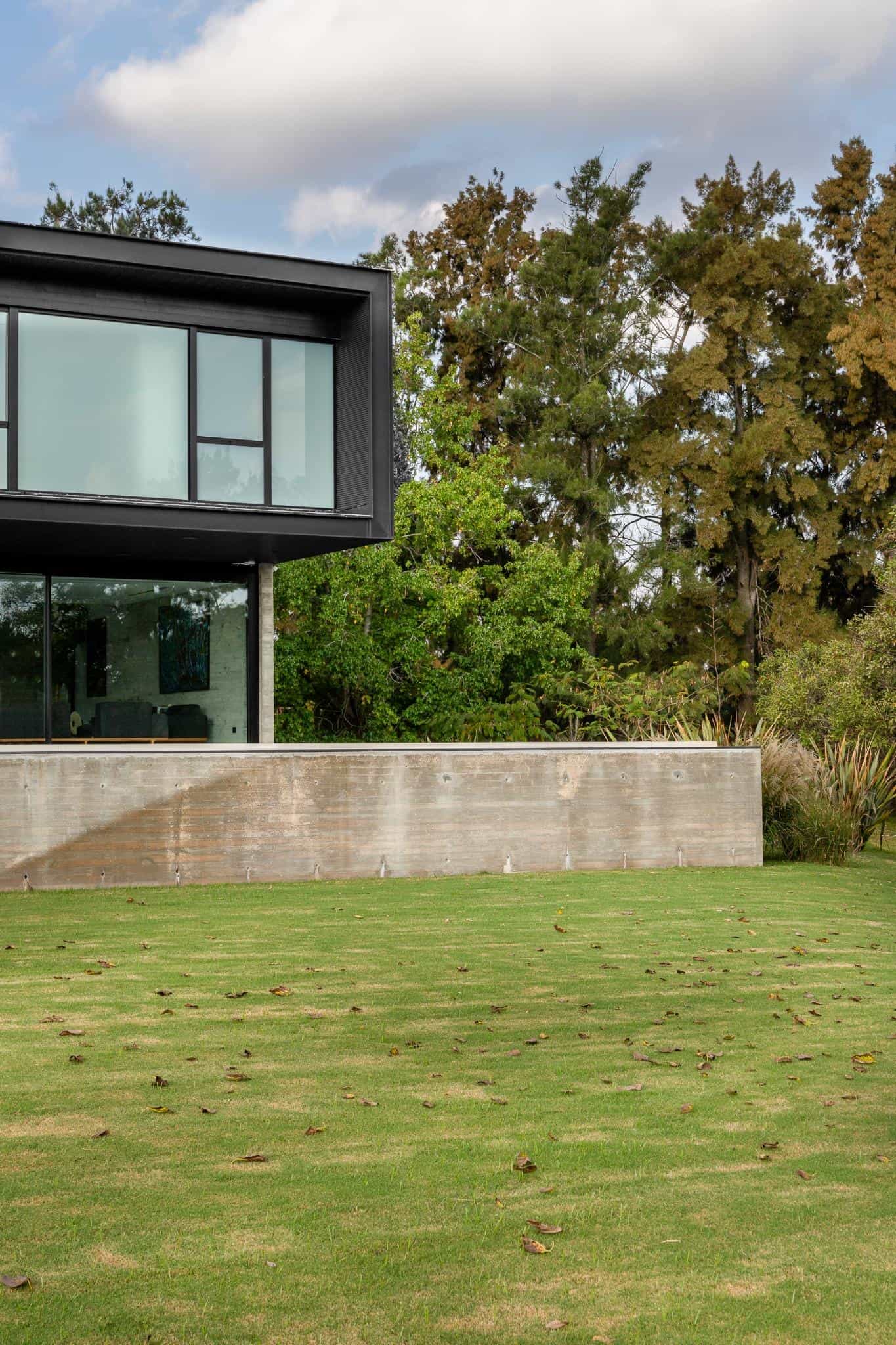 Pacheco House Cantilever and Garden Wall Cantilevered upper floor at Pacheco House with minimalist garden wall below.