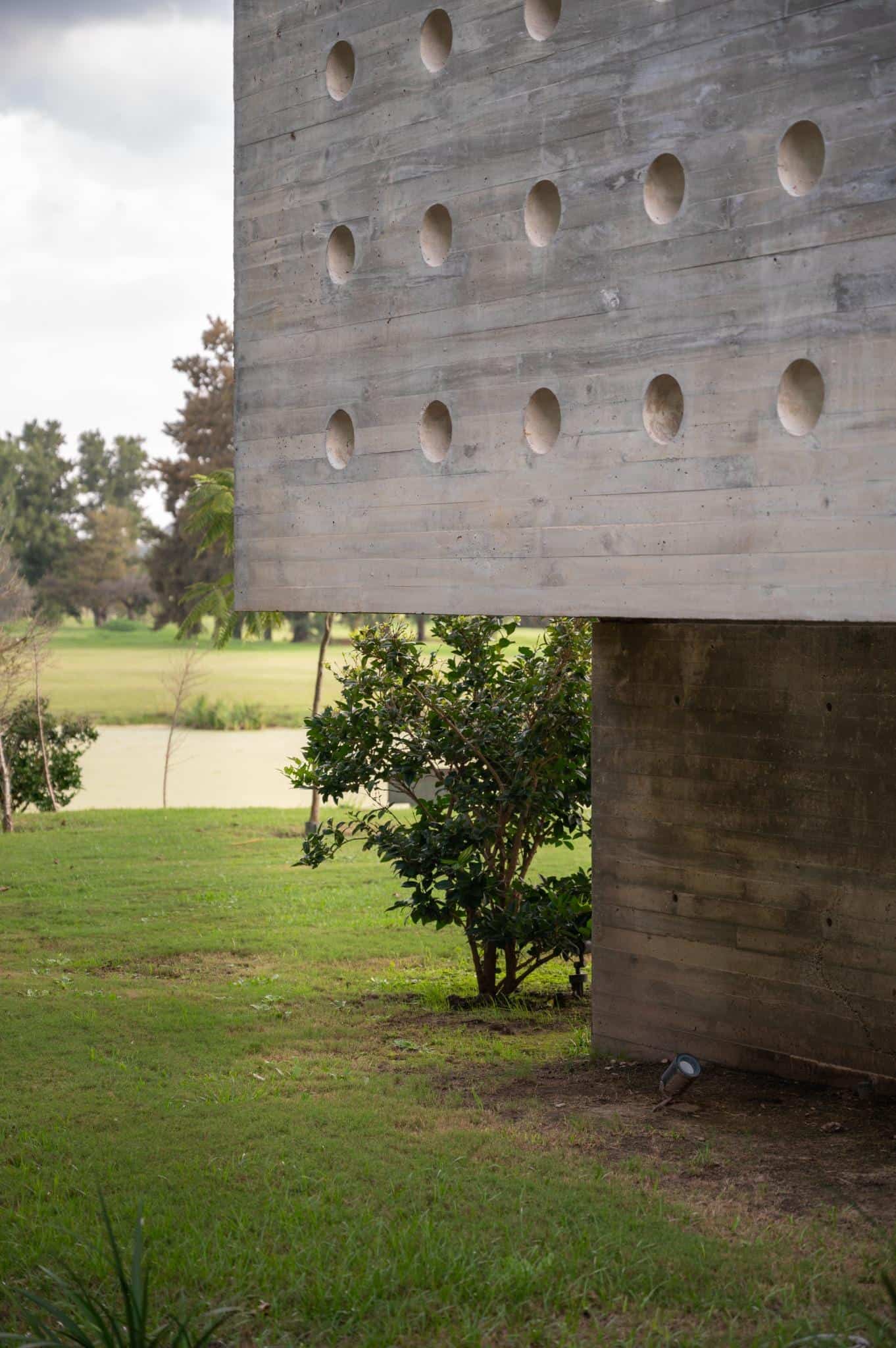 Pacheco House Cantilevered Wall Perforations Detail of the cantilevered concrete volume with circular perforations at Pacheco House.